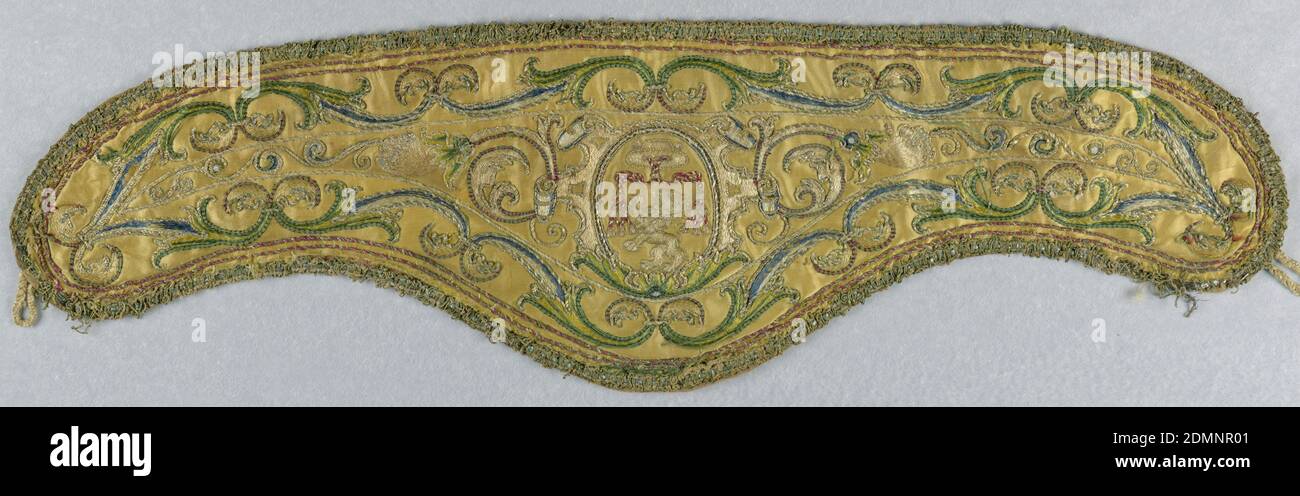 Collar, Medium: silk, metal, linen Technique: satin stitch embroidery, edged in couched gold cord, Pair of separate collars called apparels, slightly curved along top edge, with deep rounded side at bottom, to be worn over and outside a vestment. Yellow satin, embroidered in silk and metal thread. Design shows, center, in oval; a cardinal's hat above a lion rampant. Strap work frame around oval; a curving vine flows from each side, and borders of conventionalized vine edge top and bottom. Flowers and leaves worked in colored silk, in satin stitch and edged in gold cords Stock Photo