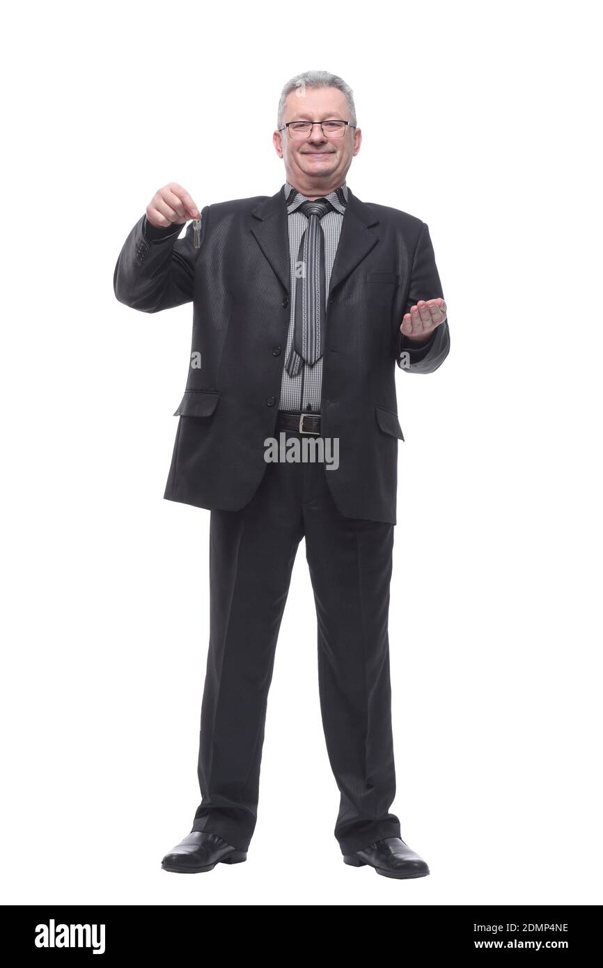 Happy businessman holding the keys and looking at camera Stock Photo