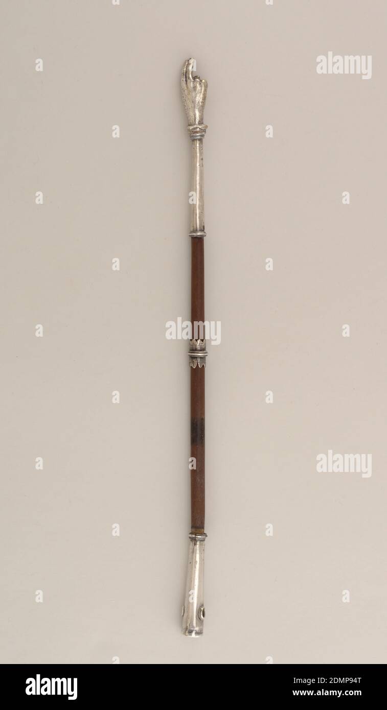 Yad, Silver, wood, Round, dark wood shaft sheathed in silver at each end with small, movable, scalloped and incised finger rest in the center. Pointer terminates in right hand with index and middle fingers extended; rumpled cuff above wrist. Sheath on grasping end is pierced for suspension., Italy or France, ca. 1800, appliances & tools, Decorative Arts Stock Photo