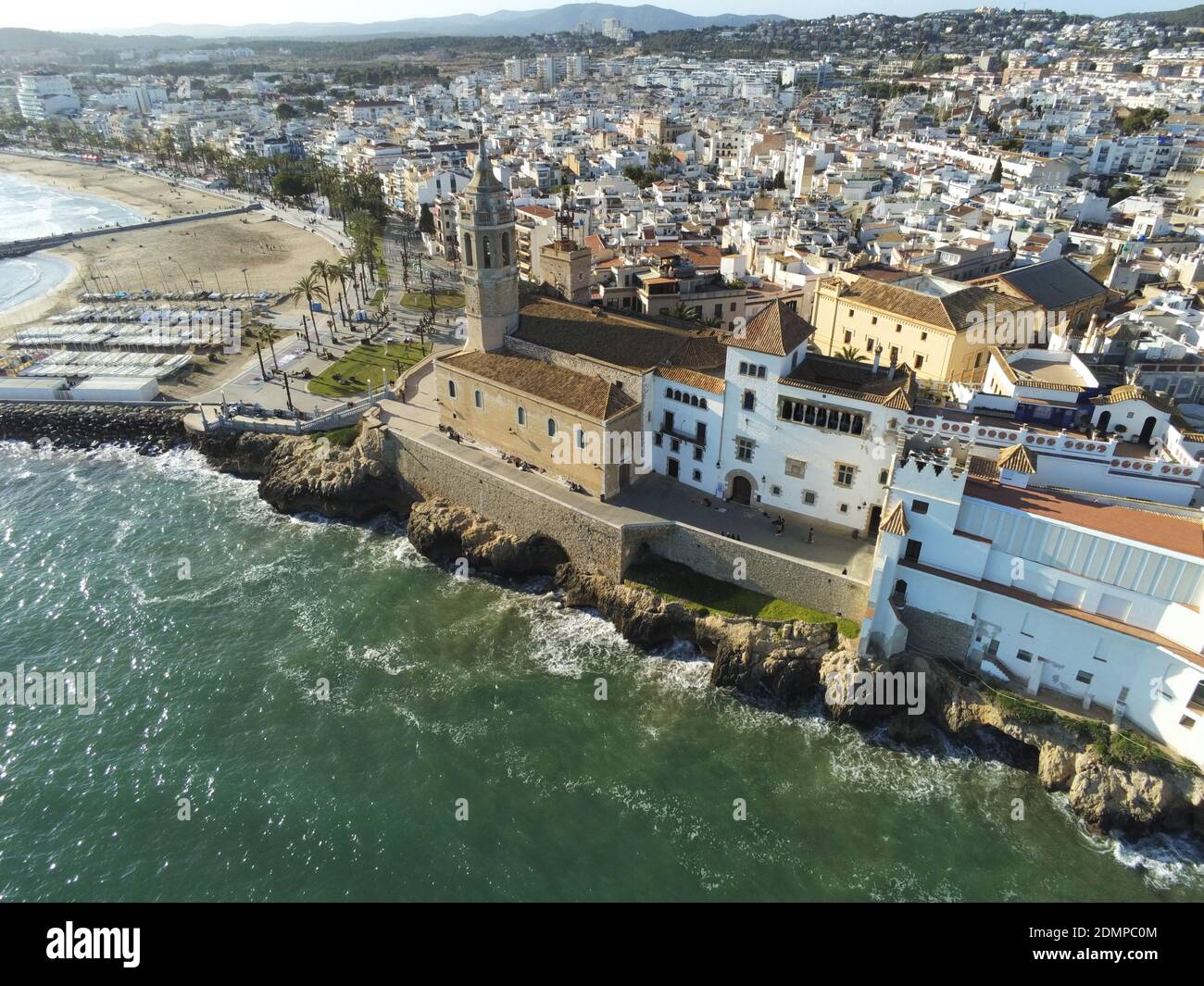 An aerial view of the coastal village of Sitges in Barcelona, Spain with the Church of Sant Bartomeu & Santa Tecla in view Stock Photo