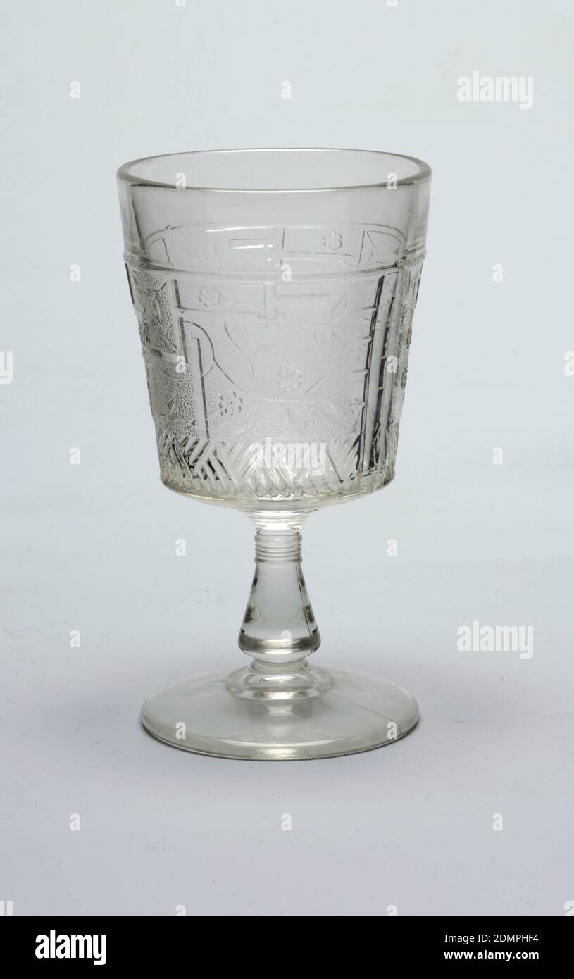 Goblet, pressed glass, Clear glass. Tapering cylindrical cup on flaring conical stem on stepped circular foot. Cup molded with Japanese-inspired decoration of fret work, flowers, and flowing stems and leaves on a pebble-textured ground above a broad band of hatched lines., ca. 1880, glasswares, Decorative Arts, Goblet Stock Photo