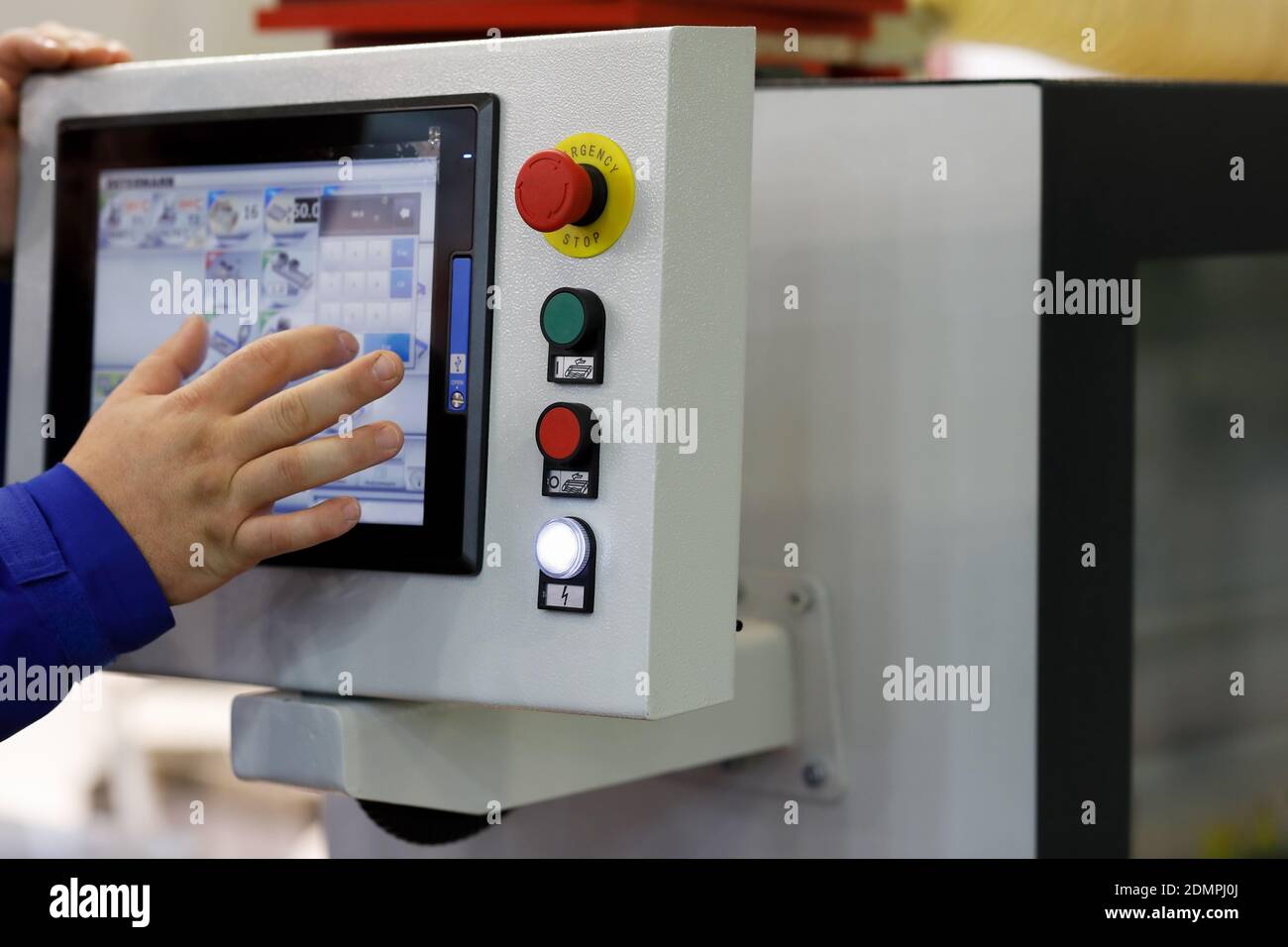 Working with touchscreen control panel of industrial equipment. Selective focus. Stock Photo