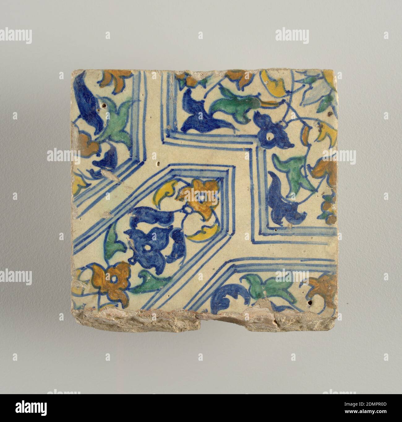 Tile, Glazed earthenware, Portion of a design composed of geometrical shapes enclosing conventionalized flowers and foliage; painted in blue, green, yellow and brown., Netherlands, late 16th century, tiles, Decorative Arts, Tile Stock Photo