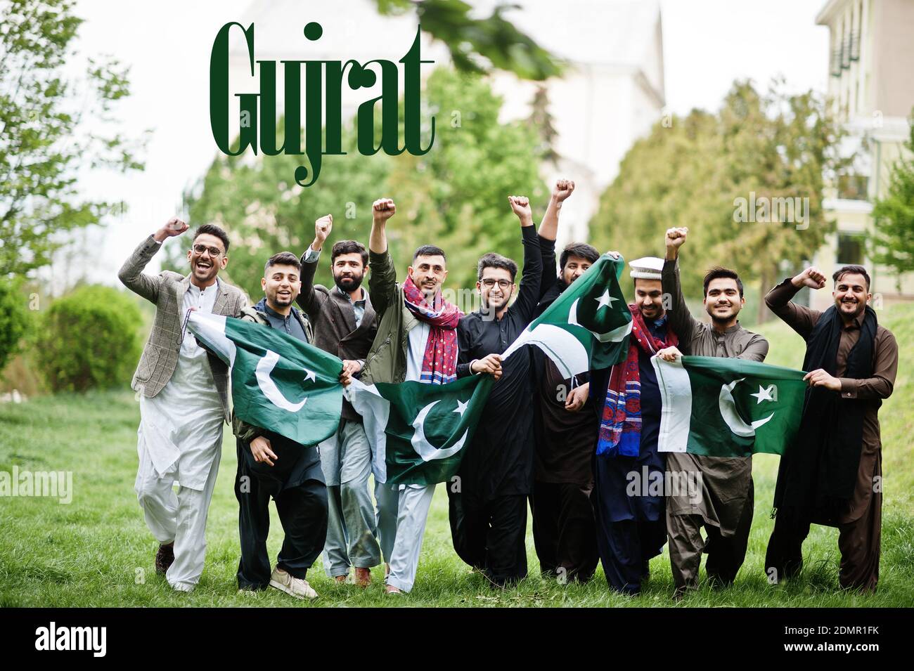 Gujrat city. Group of pakistani man wearing traditional clothes with national flags. Biggest cities of Pakistan concept. Stock Photo