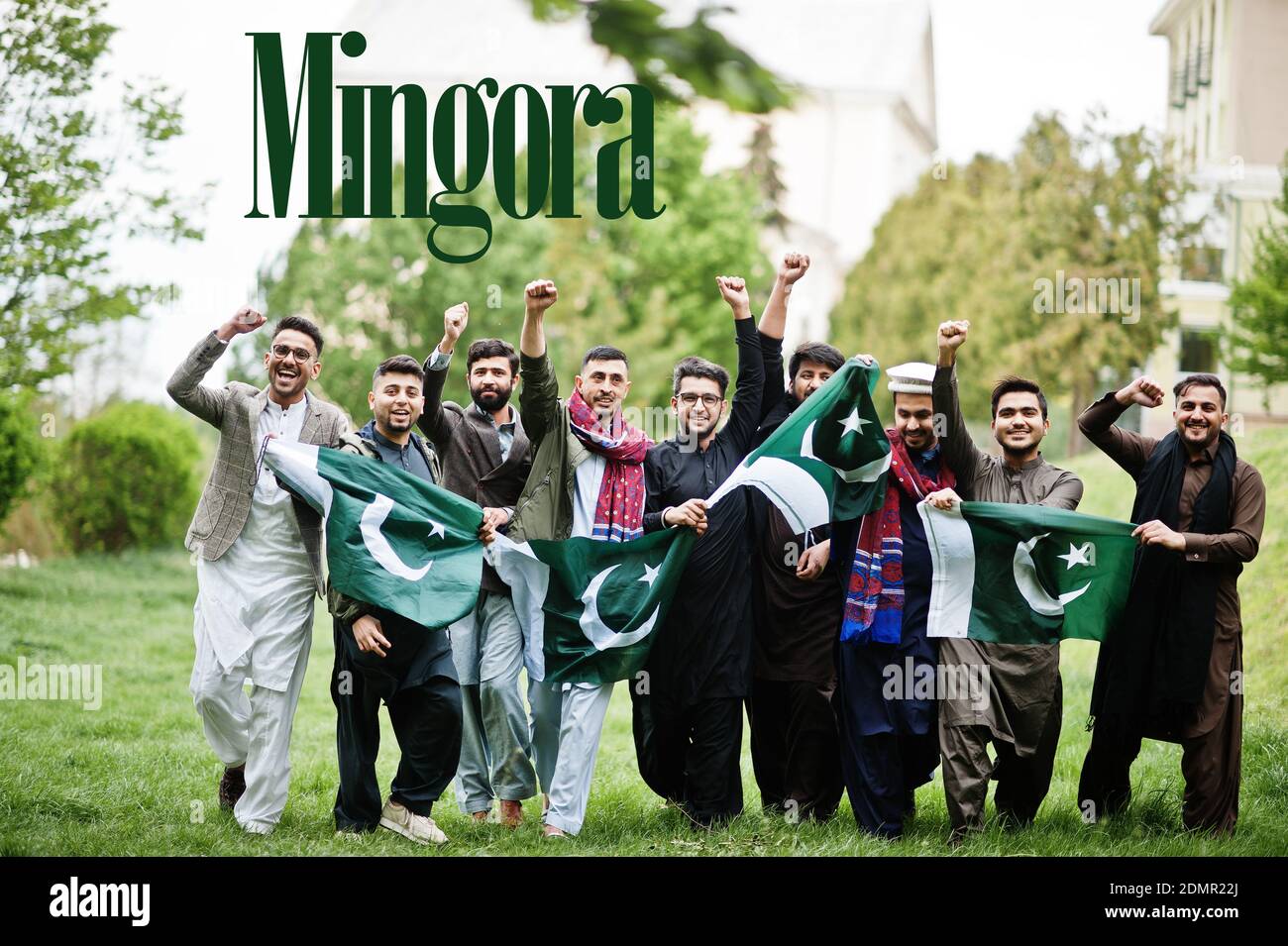 Mingora city. Group of pakistani man wearing traditional clothes with national flags. Biggest cities of Pakistan concept. Stock Photo