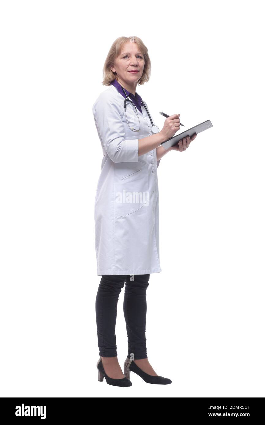 Happy smiling female doctor writing on clipboard Stock Photo - Alamy