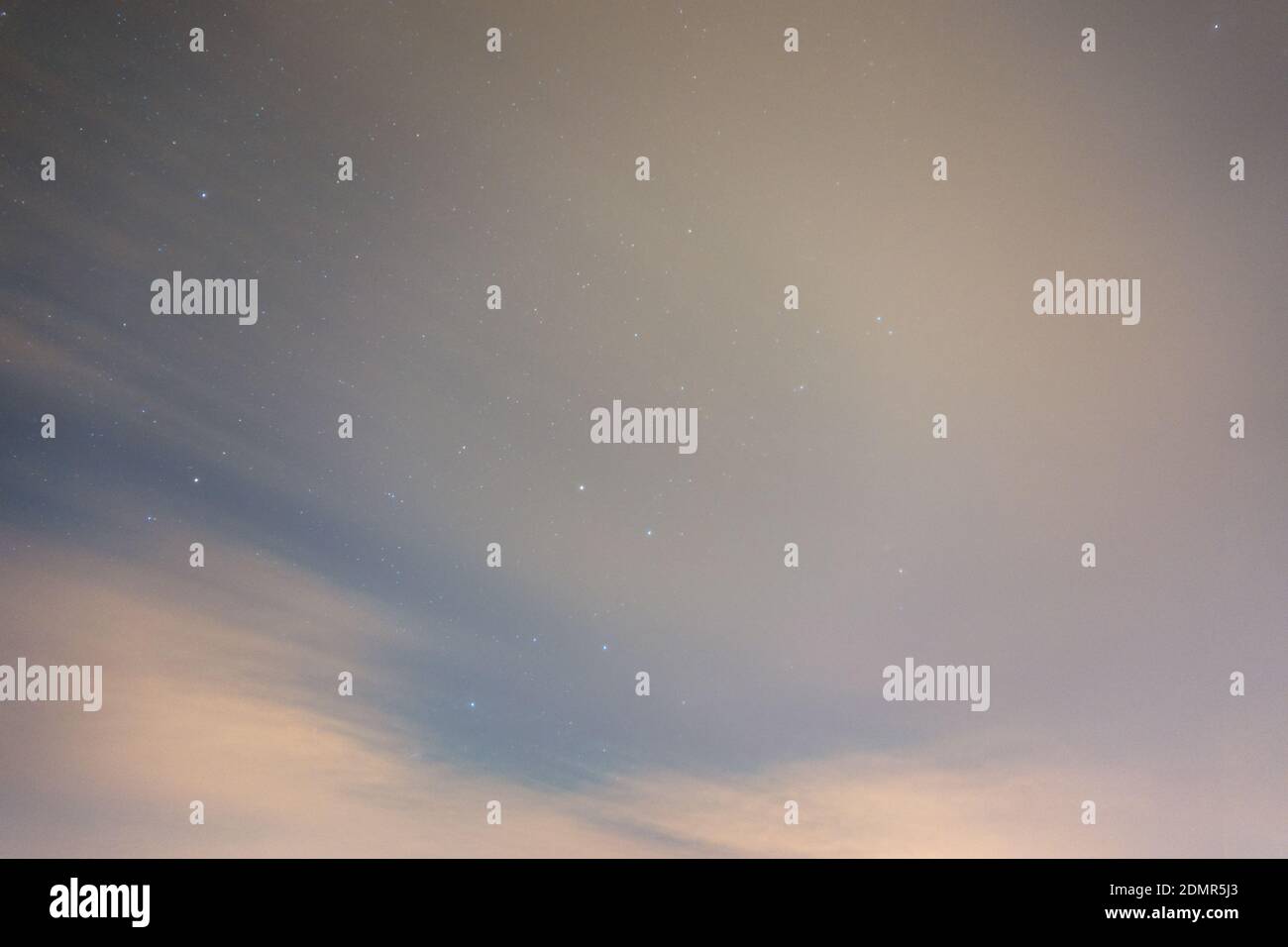 Night sky with clouds and stars, long exposure, motion blur in the