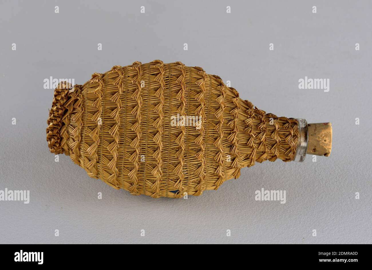 https://c8.alamy.com/comp/2DMRA0D/flask-and-stopper-glass-straw-cork-flat-oval-glass-flask-covered-in-woven-straw-conical-cork-stopper-possibly-asia-late-19th-century-containers-decorative-arts-flask-and-stopper-2DMRA0D.jpg