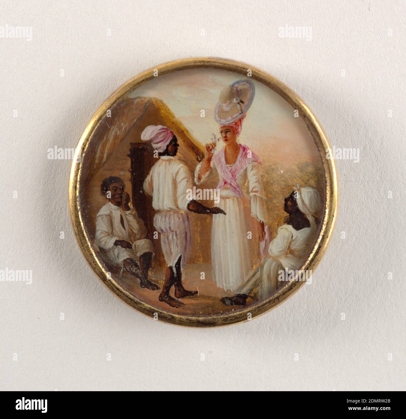 Button, Gouache paint on tin verre fixé, ivory (backing), glass, gilt metal, Button depicting scene of four figures outside before a thatched hut. At center, a man in striped pants and white shirt faces a woman in a dress with a pink scarf who smells a flower. Seated man and woman on either side stare up at central couple., late 18th century, costume & accessories, Decorative Arts, Button Stock Photo