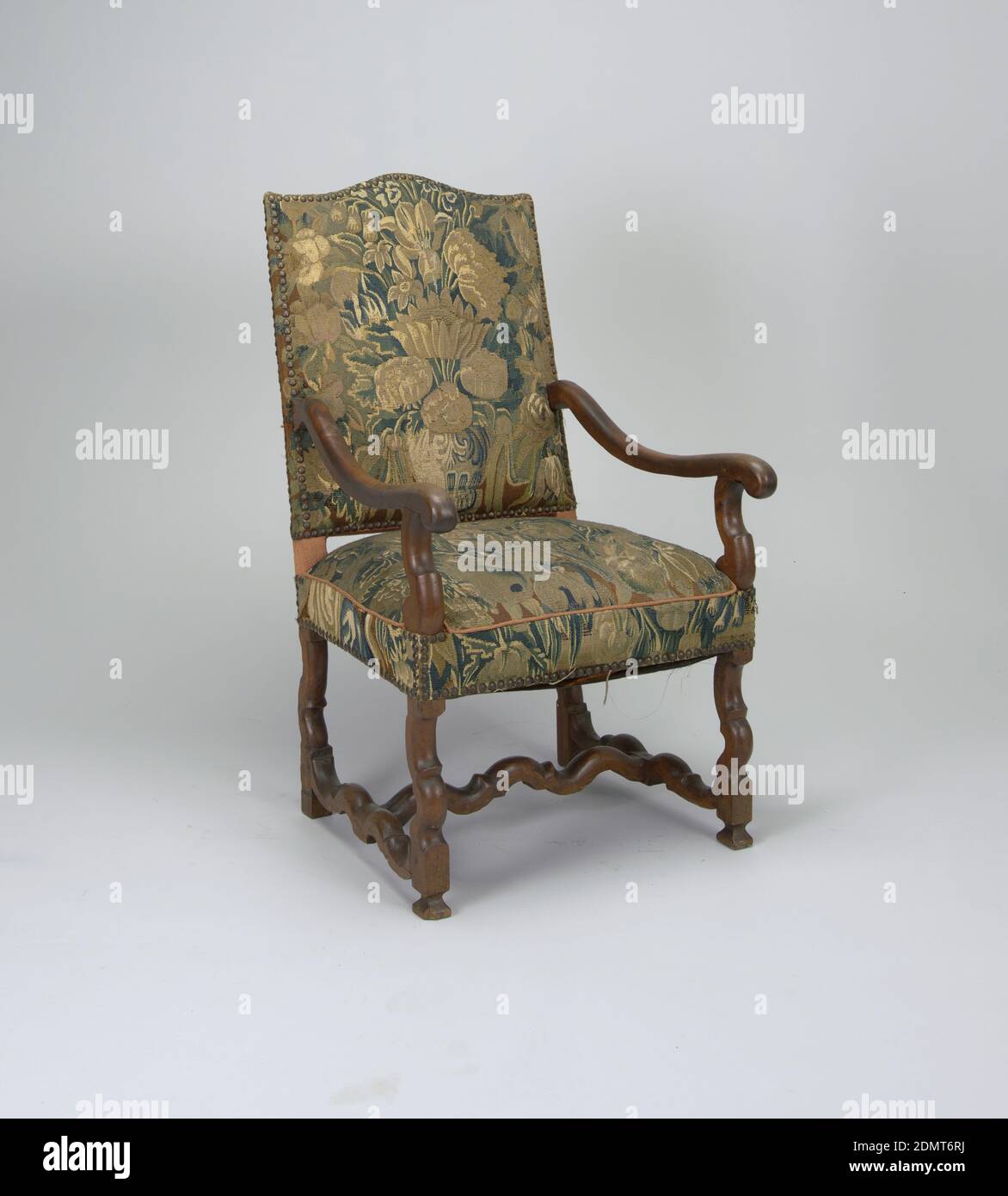 Armchair, wood, metal, upholstery, Open armed armchair, back and seat covered in tapestry attached via brass buttons, curvilinear legs and stretchers at base. Chair's armrails depart from halfway up chair-back, dipping and swinging outwards., Europe, early 18th century, furniture, Decorative Arts, Armchair Stock Photo