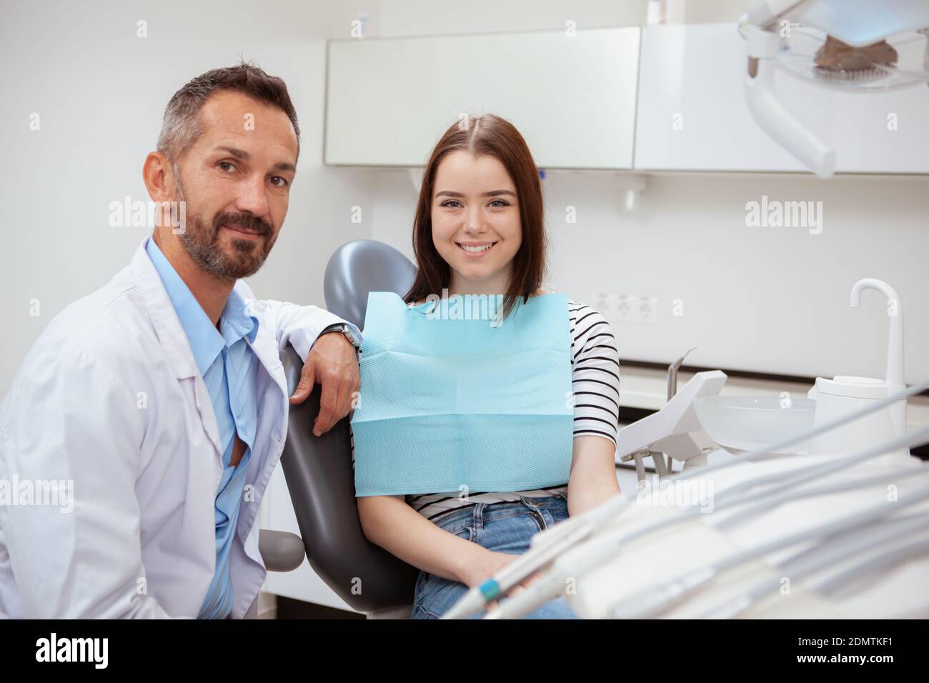 Attractive young female dentist in hi-res stock photography and