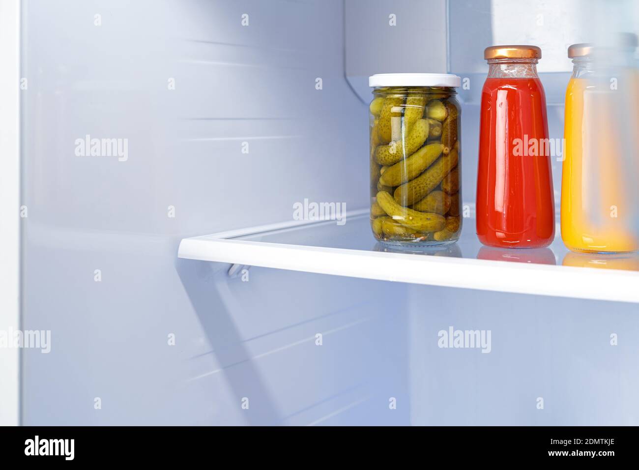 Glass jars of canned products on a fridge shelf Stock Photo Alamy