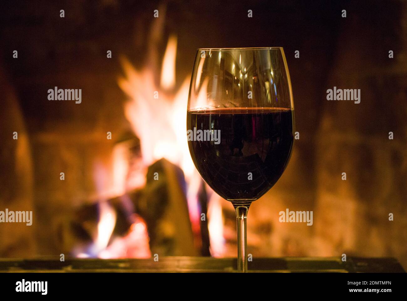Red Wine On The Fireplace Background Stock Photo Alamy