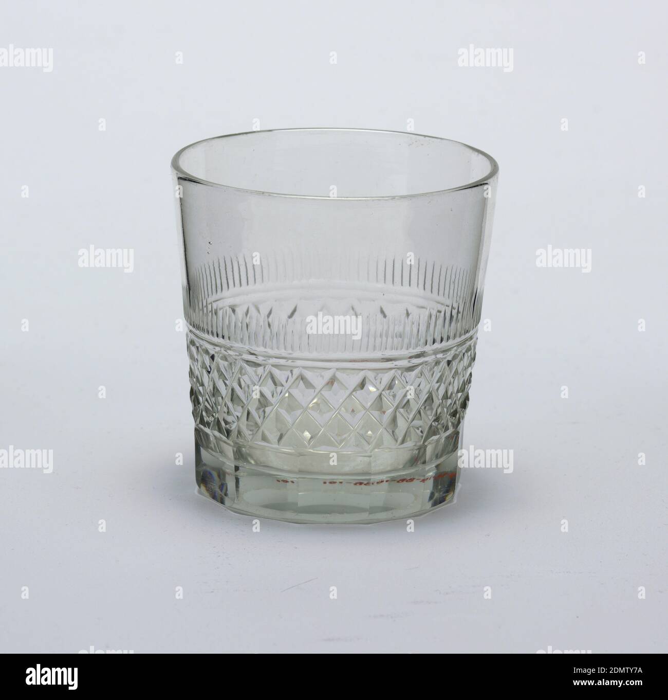 https://c8.alamy.com/comp/2DMTY7A/glass-glass-medium-heavy-glass-plain-tumbler-shape-with-straight-flaring-sides-lower-side-divided-into-two-nearly-equal-bands-the-lower-cut-to-form-a-polygonal-based-of-thirteen-sides-the-upper-of-shallow-diamond-cutting-with-flattened-tops-above-a-double-incised-ring-is-a-band-of-short-vertical-blazes-upper-two-fifths-of-tumbler-is-plain-base-is-heavy-and-underside-has-a-shallow-circular-depression-waterford-ireland-182030-glasswares-decorative-arts-glass-2DMTY7A.jpg