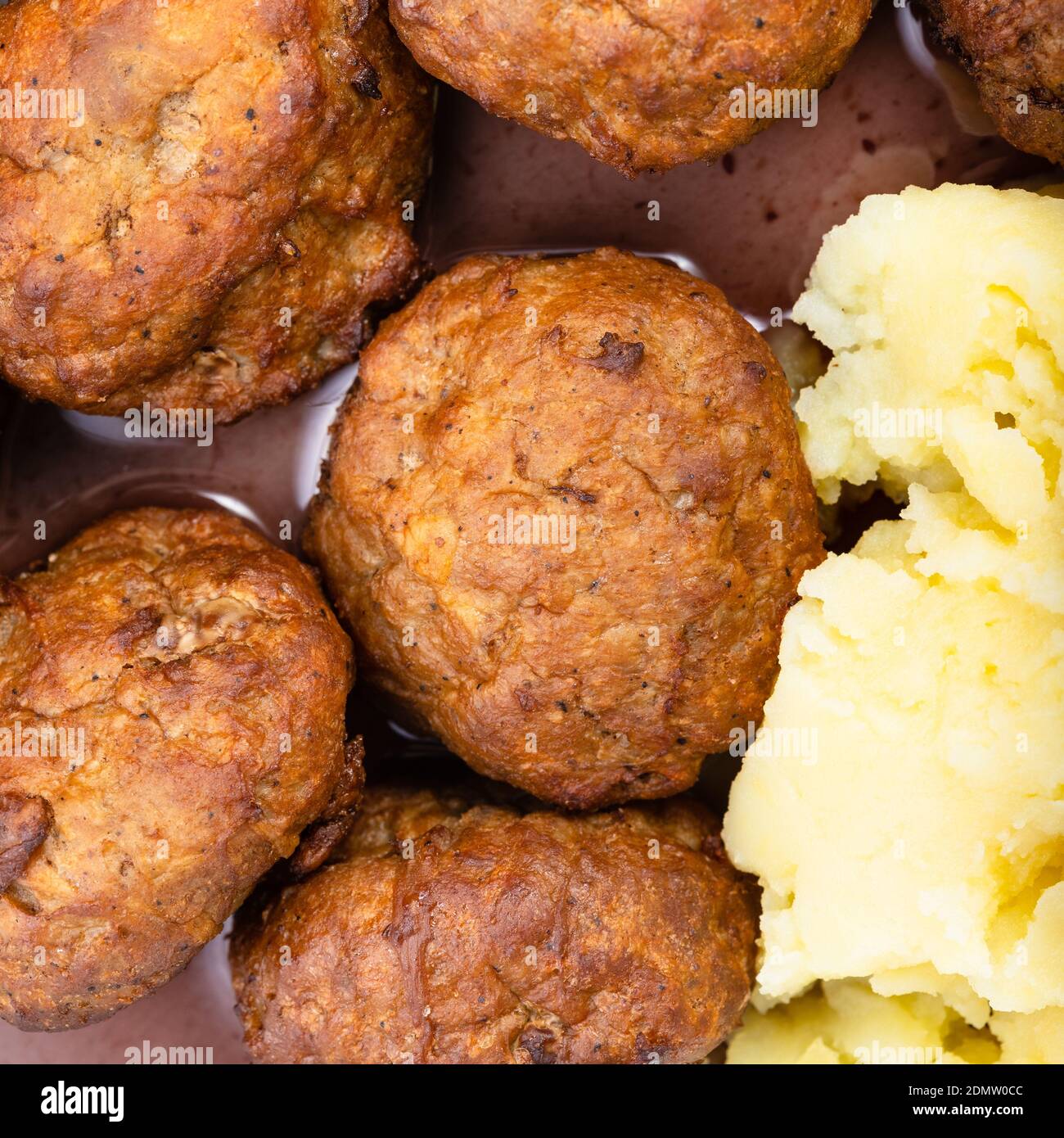 top view of cooked swedish meatballs with lingonberry sauce and mashed potatoes close up Stock Photo