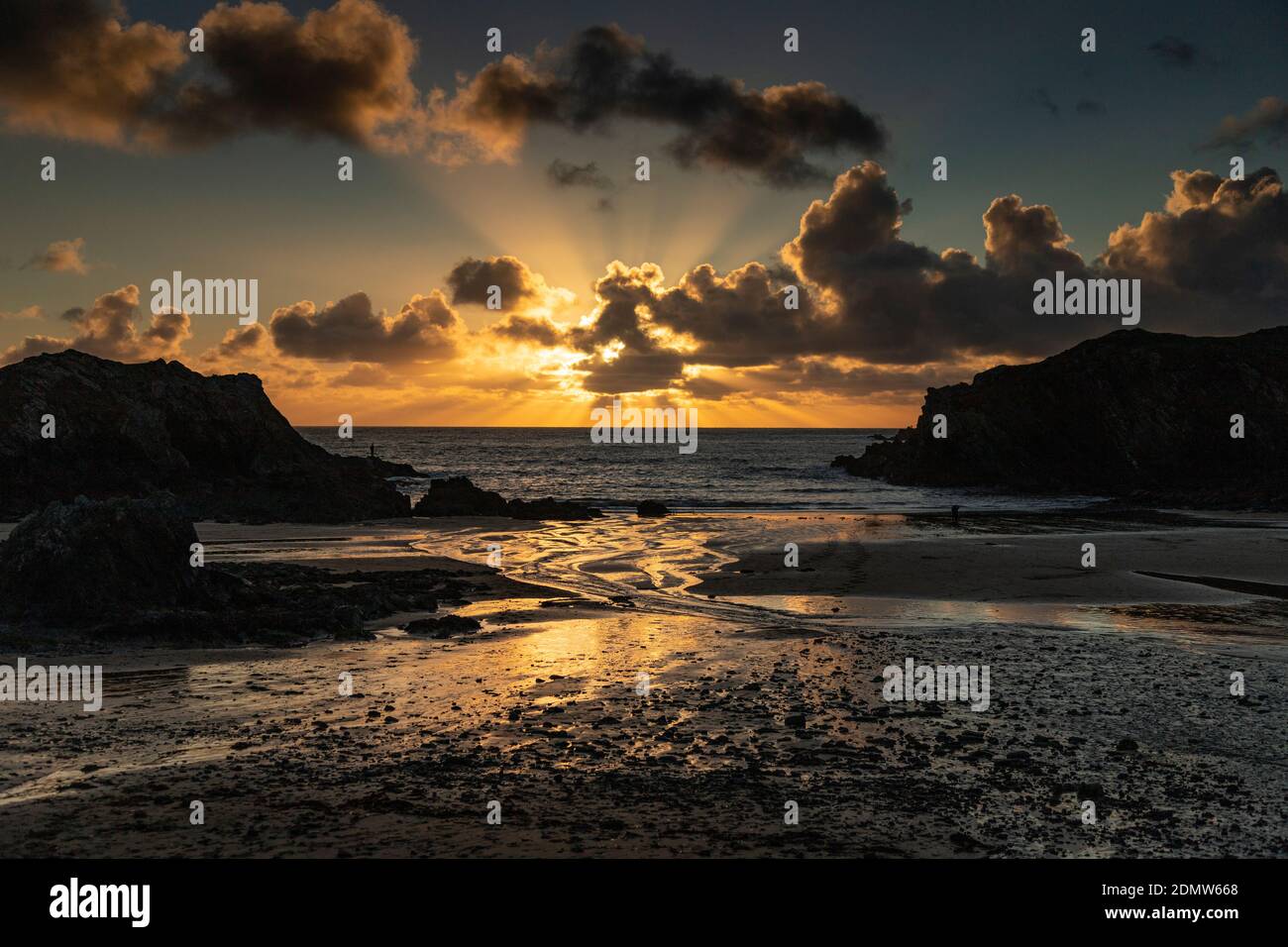 Sunset over the beach at Porth Dafarch, Anglesey, North Wales Stock Photo