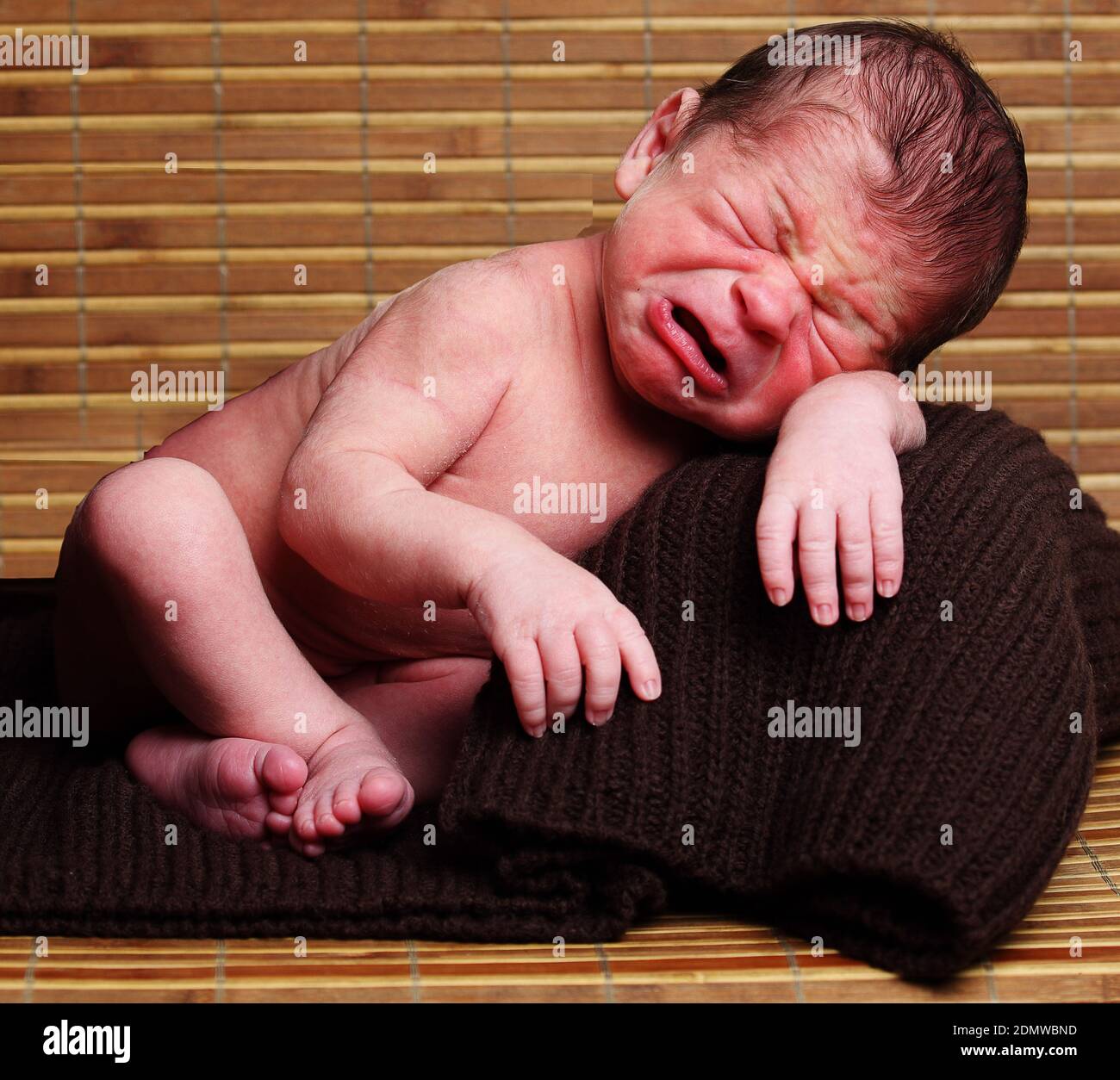 crying baby with wooden background Stock Photo