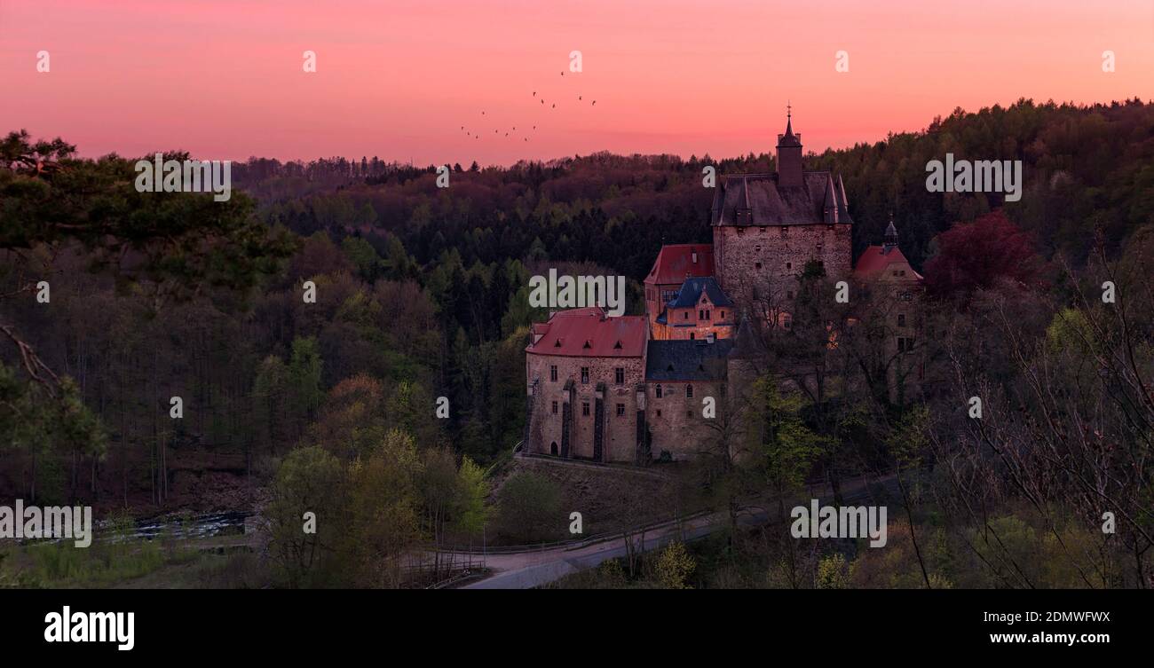 Kriebstein Castle at Sunset. Die Burg Kriebstein im Sonnenuntergang Stock Photo