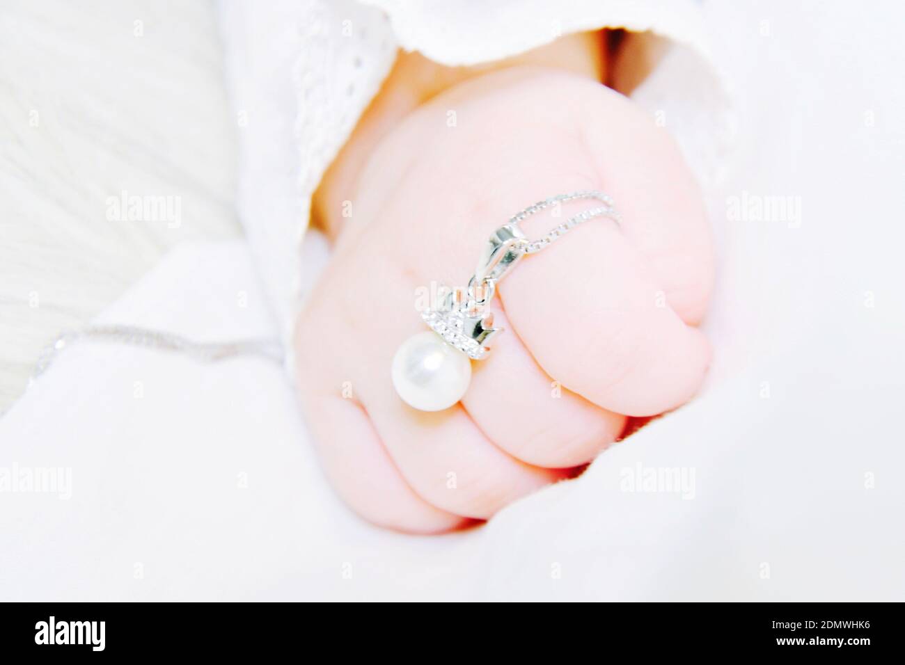 Baby hand holding finger ring hi-res stock photography and images - Alamy
