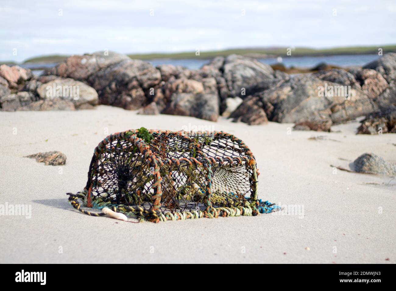Lobster pot washed up on Scottish beach Stock Photo