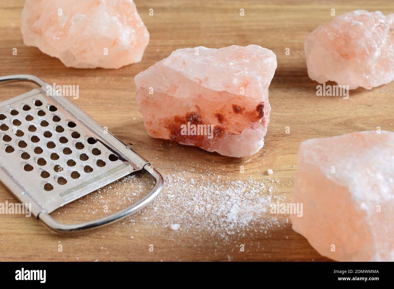 Closeup Of Grater And Rock Salt On Table Stock Photo Alamy