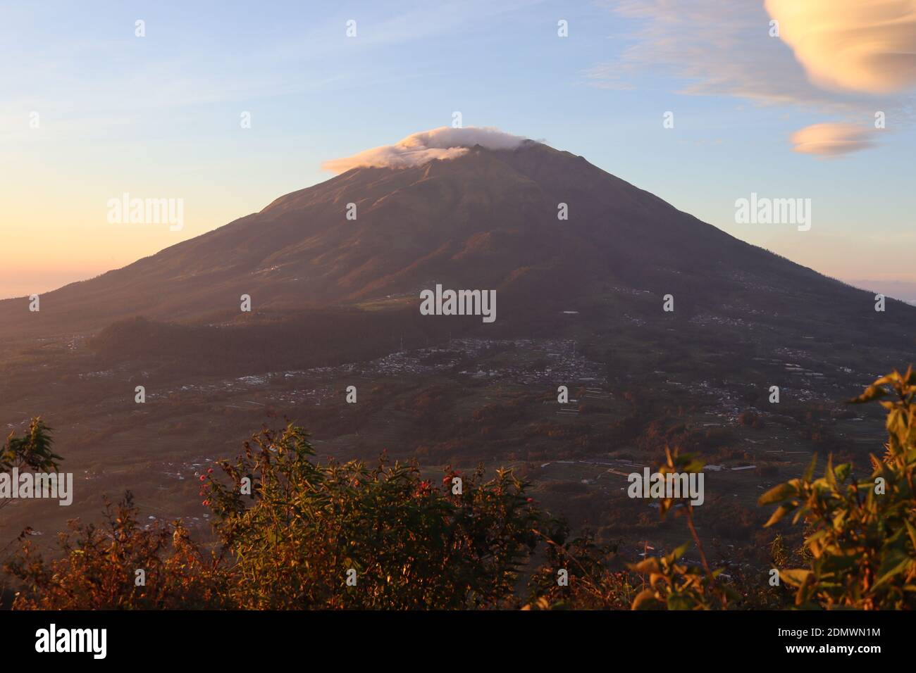 The landscape of Mount Merbabu, which is dashing, rises in the morning with the sweet sunshine that envelops its prowess Stock Photo