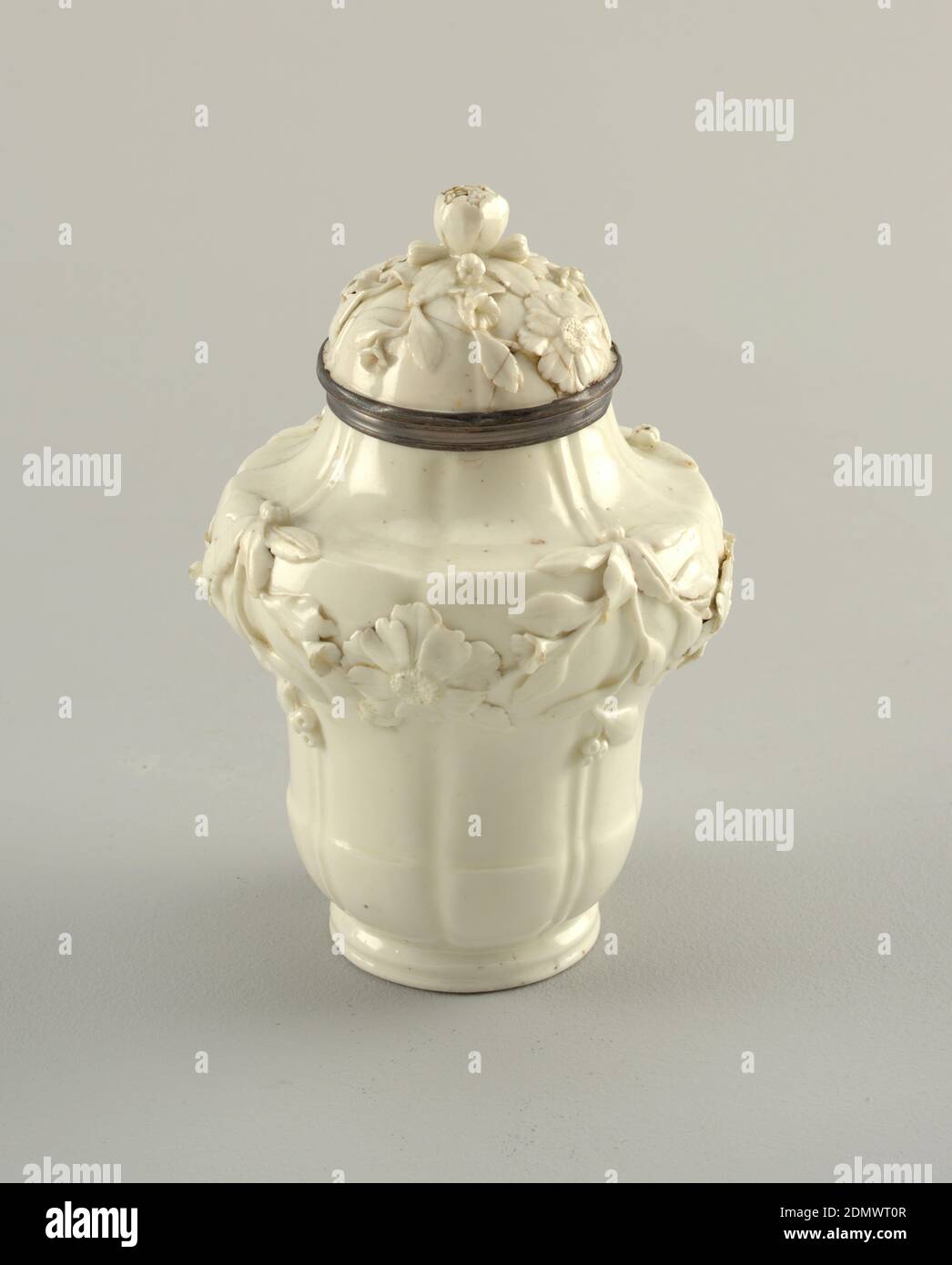 Covered Jars, Mennecy Porcelain Manufactory, French, active 1735 – 1773, soft paste porcelain, vitreous enamel, Inverted acorn shaped with cavetto neck and domed cover with floral knob. Cylindrical foot; side broken by four vertical grooves alternating with four ridges. Floral festoons in relief on shoulders, flowers in relief upon covers, which have silver rims., France, 1740–1750, ceramics, Decorative Arts, jars, jars Stock Photo