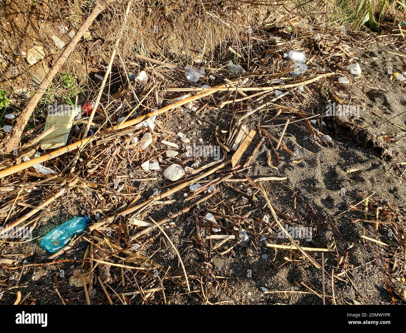 Plastic waste dump on dirty ocean coast polluted ecosystem after sea storm Stock Photo