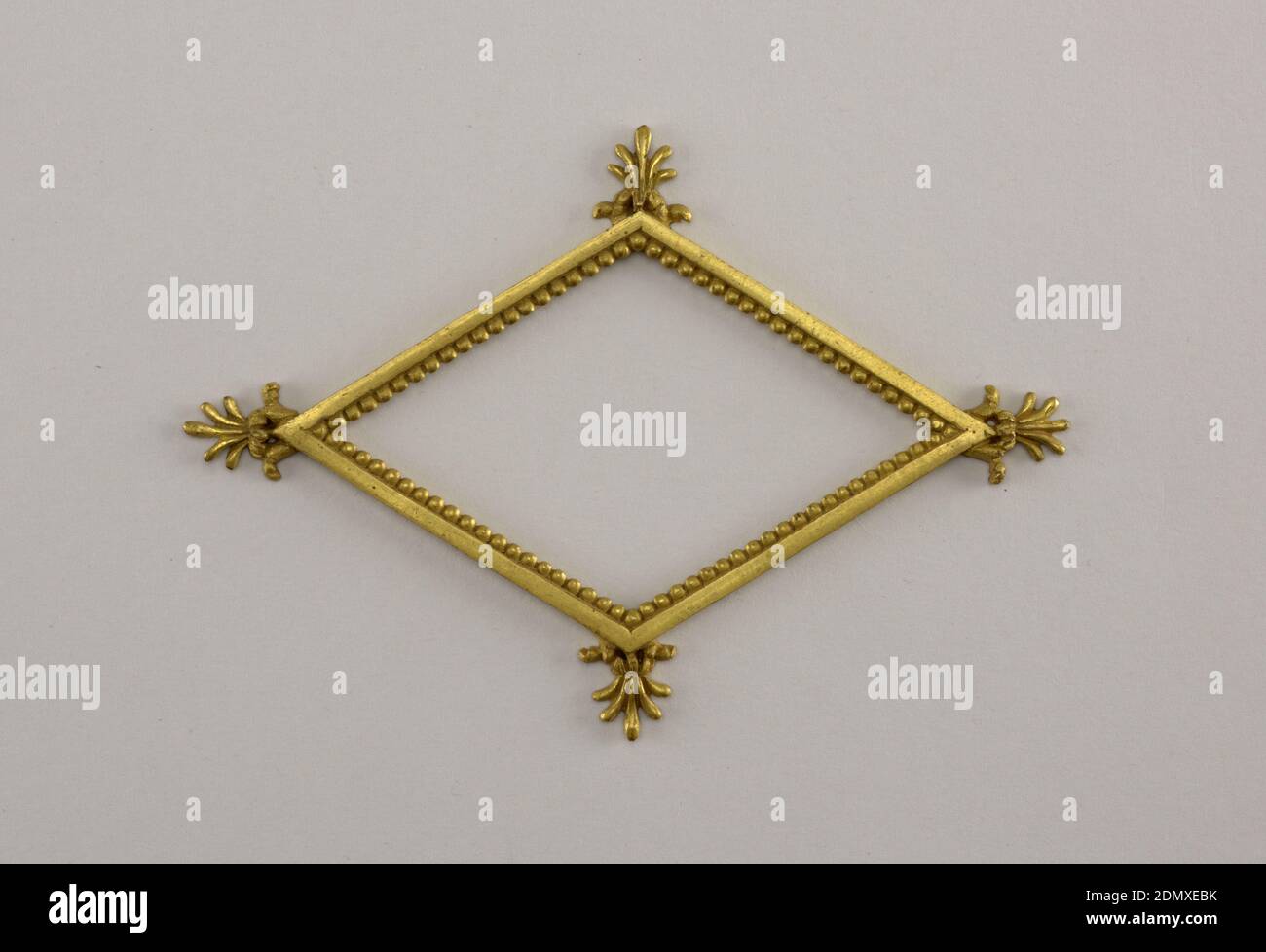 Frame, Cast and gilt bronze, Horizontally oriented lozenge-shaped form with palmettes at each corner., France, ca. 1800, metalwork, Decorative Arts, Frame Stock Photo
