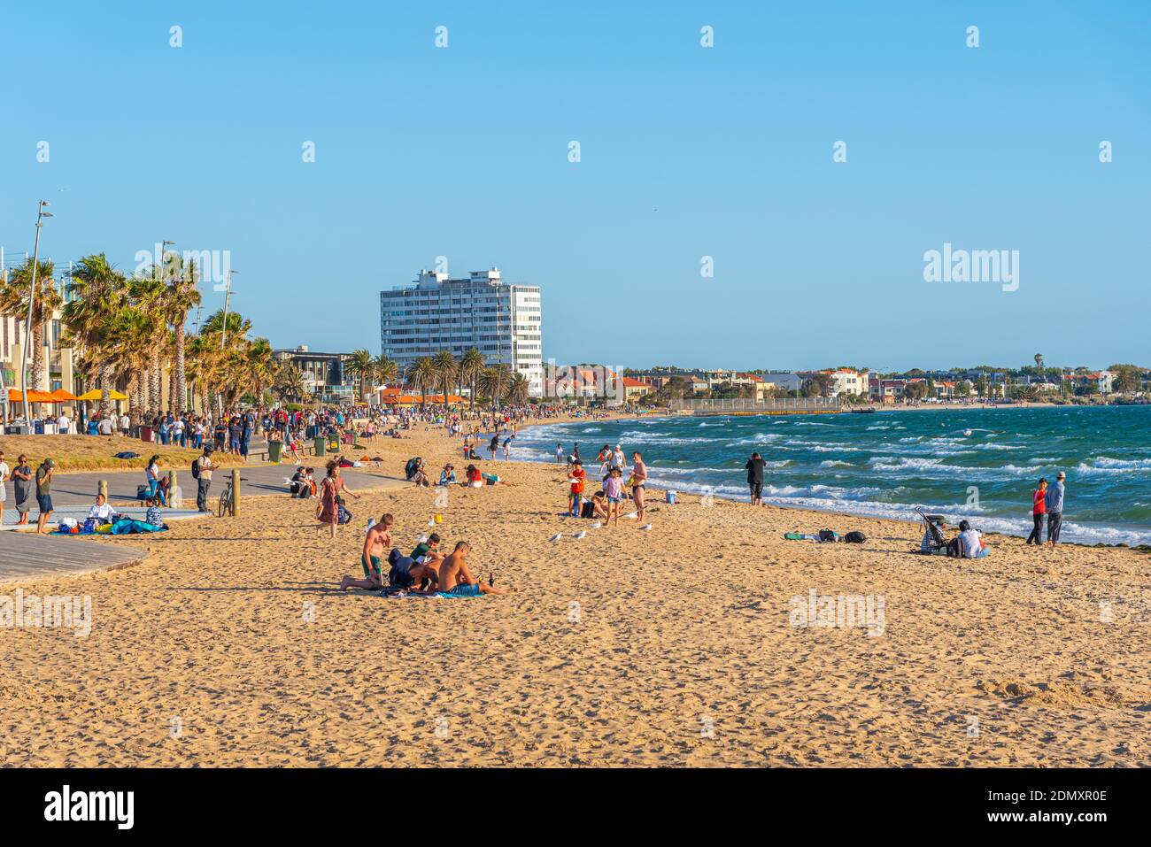 MELBOURNE, AUSTRALIA, JANUARY 1, 2020: People are enjoying a sunny day on a beach at St. Kilda, Australia Stock Photo