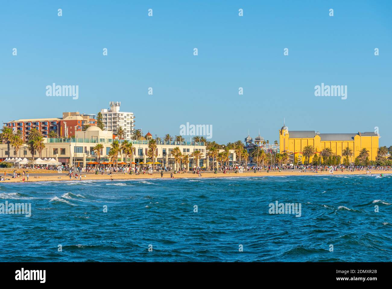 MELBOURNE, AUSTRALIA, JANUARY 1, 2020: People are enjoying a sunny day on a beach at St. Kilda, Australia Stock Photo
