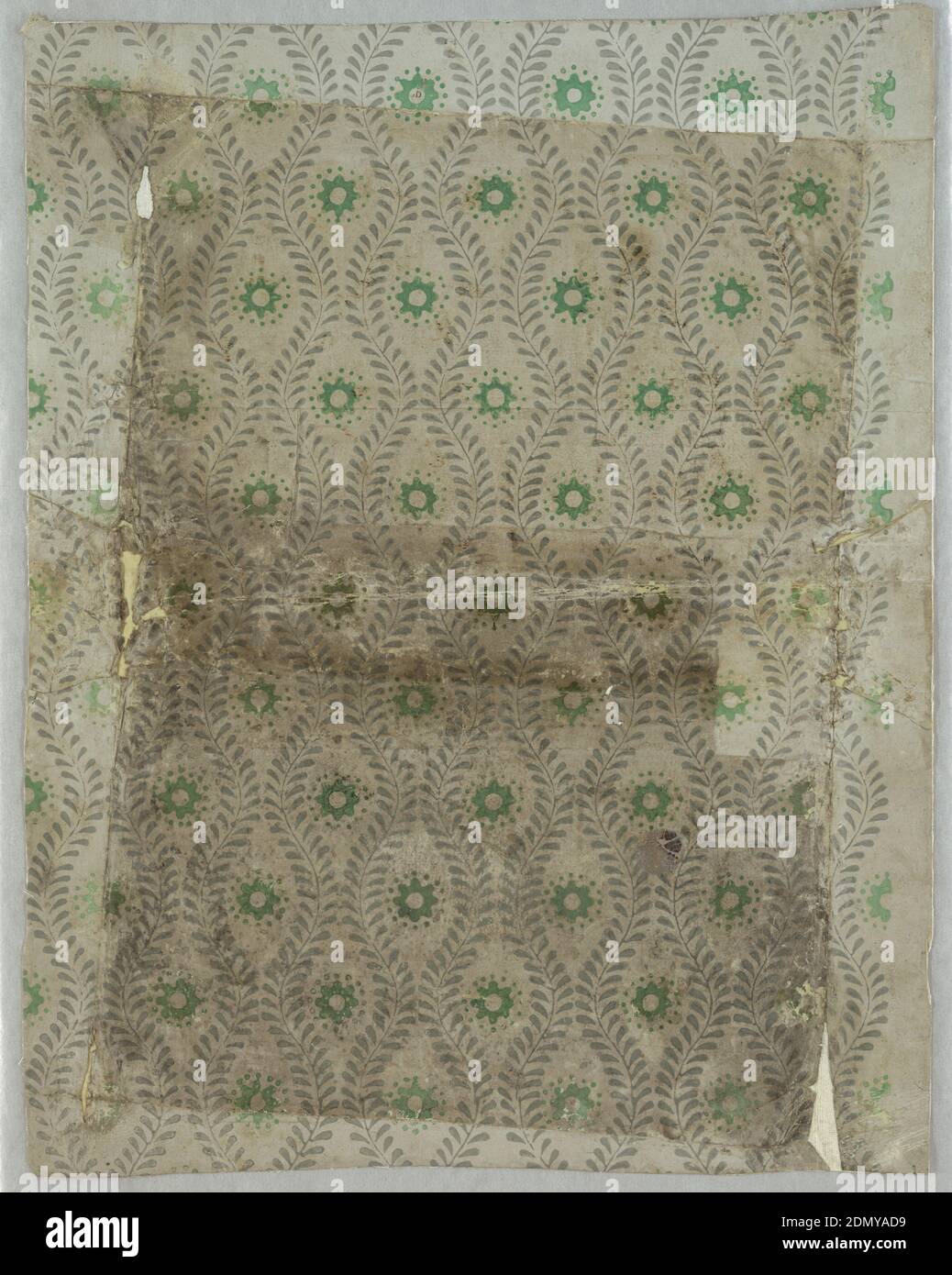 Sidewall - fragment, Block-printed, distemper colors, Alternating vertical serpentine foliate bands enclosing irregular ellipses, each set with a green flower form surrounded by a circle of green dots. Border present along right edge. Original colors appear along edges, where paper has been folded. Paper has small threads in it. Formerly used as a book cover., England, ca. 1800, Wallcoverings, Sidewall - fragment Stock Photo