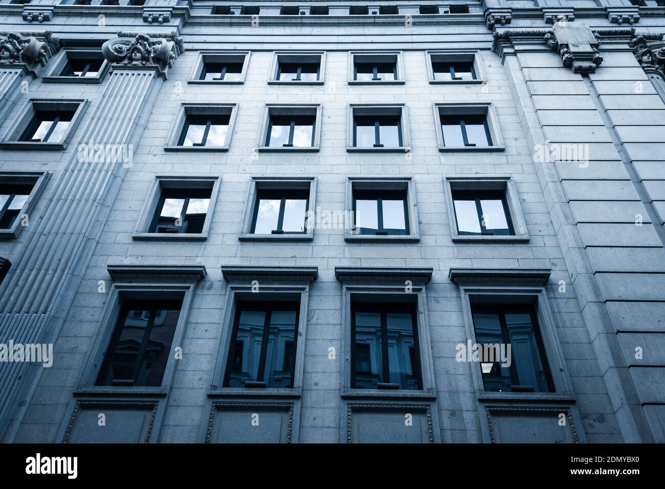 Instituto Cervantes side facade in Madrid. Spanish public institution. Eclectic architecture style concept, cold blue effect applied Stock Photo