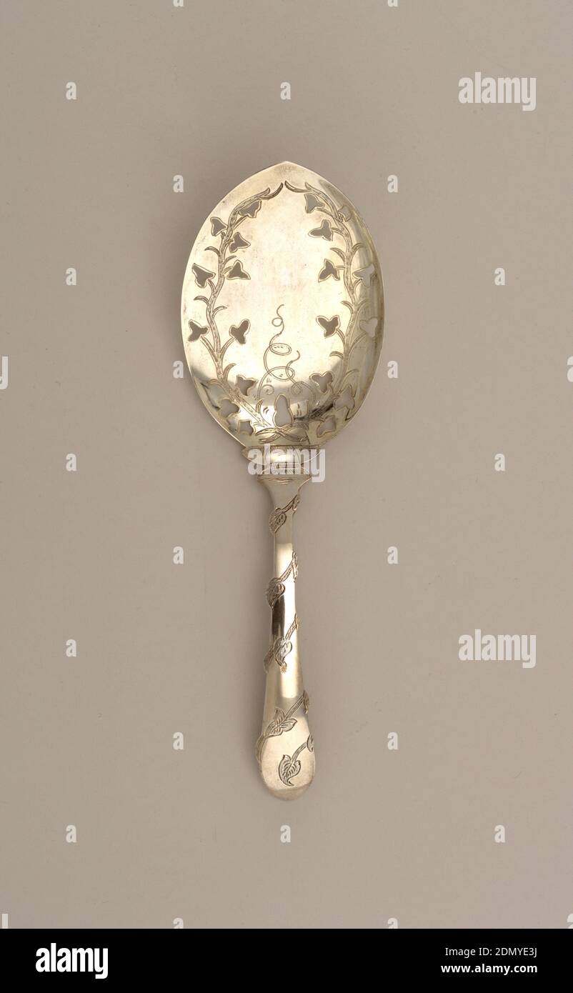 Spoon, J. M. van Kempen and Sons, founded 1835, Silver, The shallow pointed oval bowl with a flat edge and a slightly curved edge. The surface engraved with two crossed ivy fronds with pierced leaves encircling the bowl. The flat, slightly curved stem engraved with spiralling ivy vine. With rounded pointed terminal., Voorschoten, Netherlands, 1877, cutlery, Decorative Arts, Spoon Stock Photo