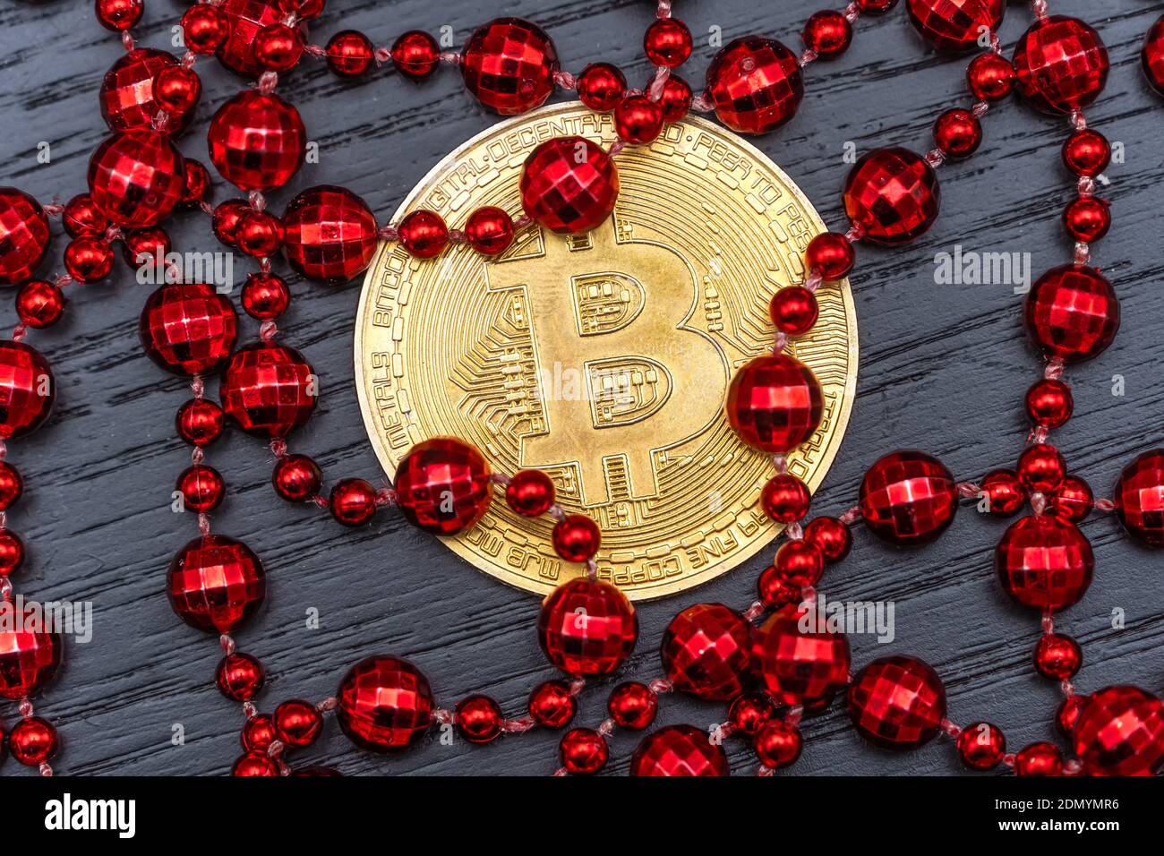 Gold coin bitcoin lies on a dark 