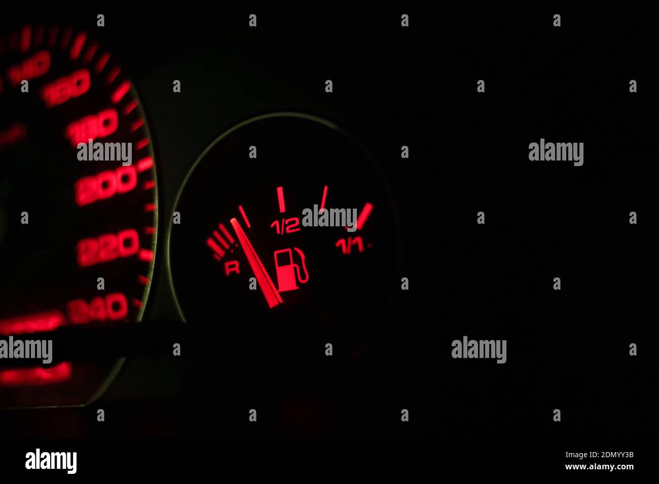 Fuel tank level on the instrument panel with red illumination in the