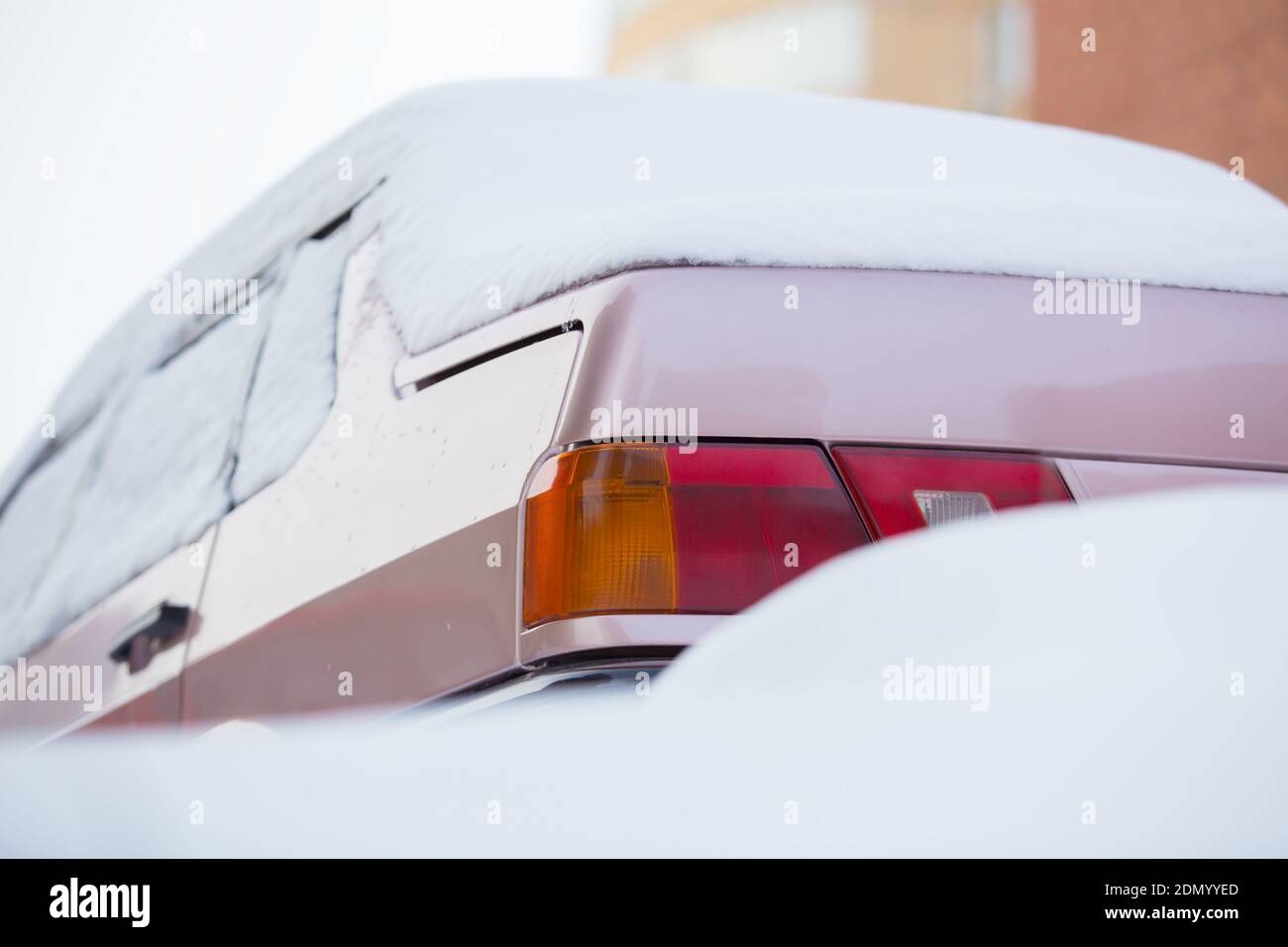 car in winter under snow layer Stock Photo