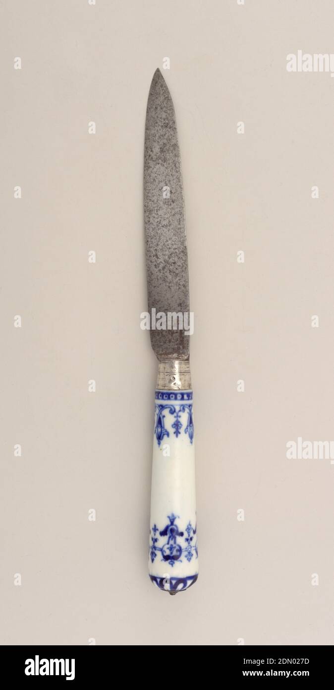 Knife with Blue Pattern on Porcelain Handle, Saint-Cloud Porcelain Manufactory, French, active by 1693 - 1766, porcelain, vitreous enamel, silver, steel, Leaf-shaped blade, almost straight edges, plain bolster. Silver ferrule with horizontal bands. Tapering white porcelain handle with dark blue floral and scrolled decoration. Silver button cap at the top of the handle., France, ca. 1730, cutlery, Decorative Arts, knife, knife Stock Photo