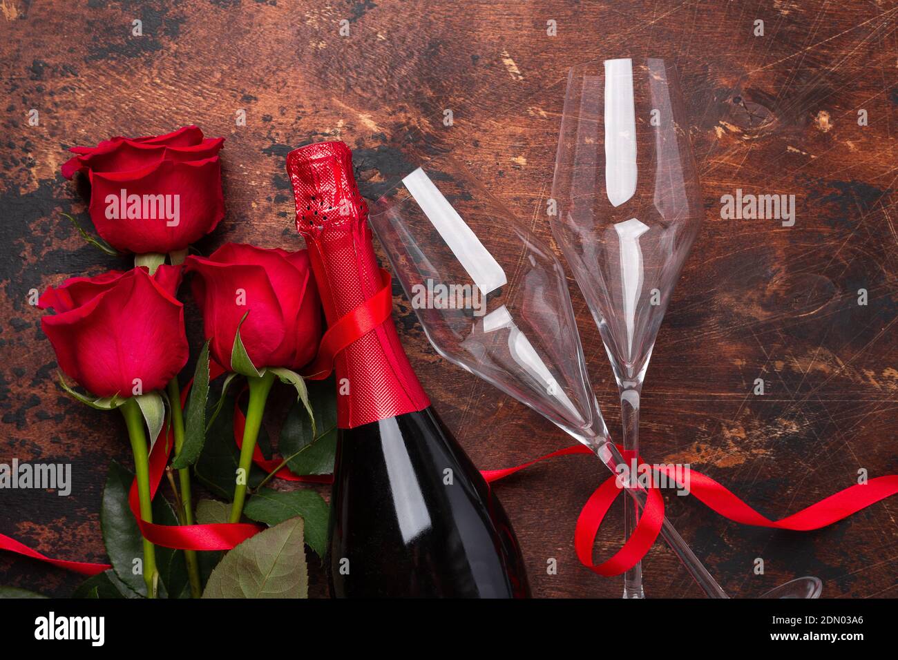 Valentine's day greeting card with red rose flowers and champagne ...