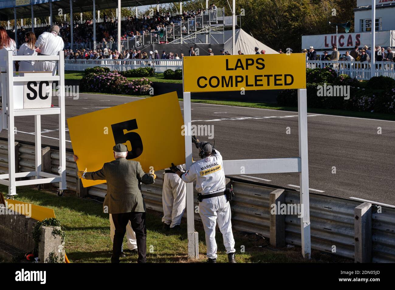 The marshalls keep count of the laps raced at the Goodwood Revival meeting of 2019 Stock Photo