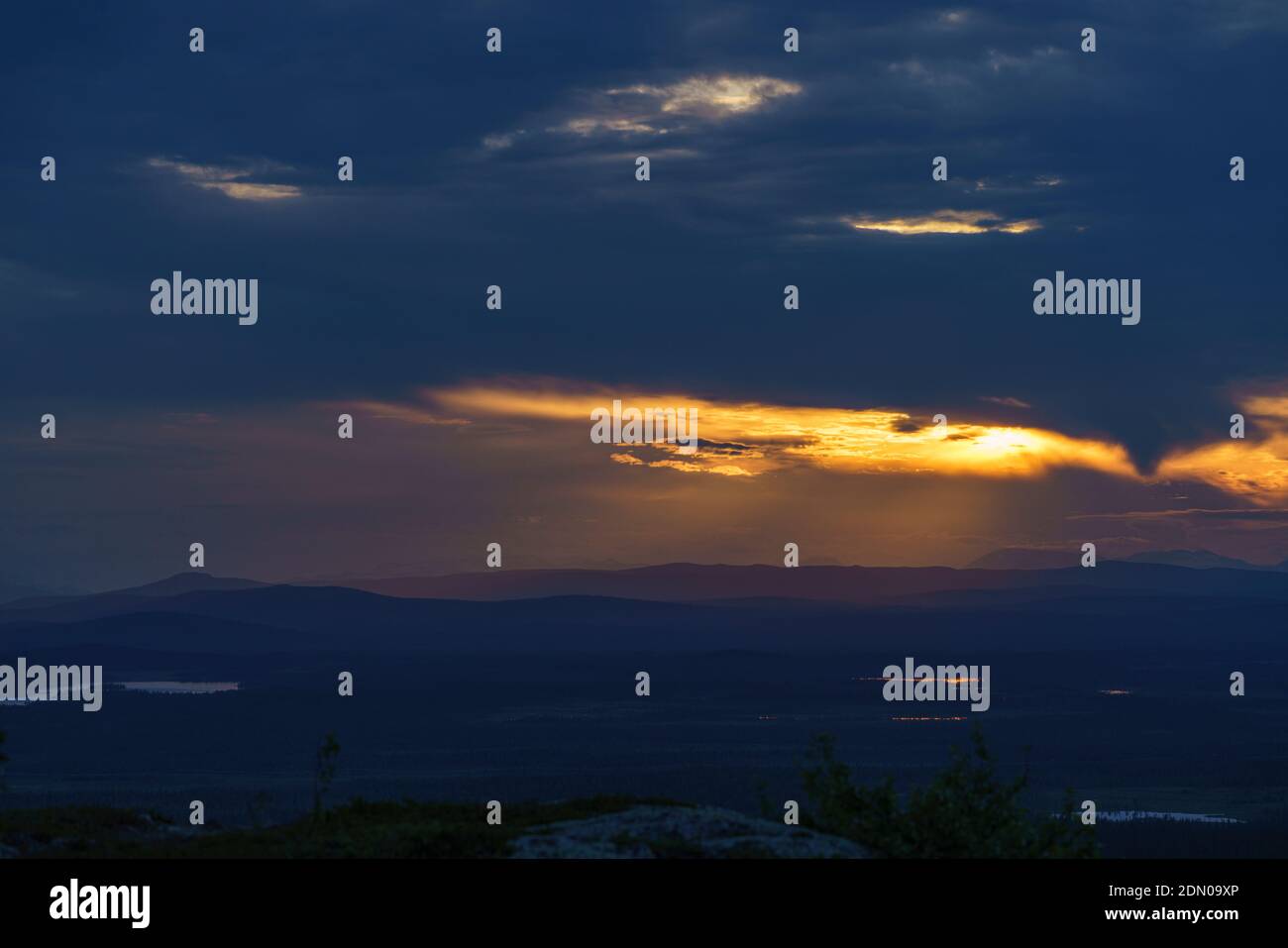 Vew from mount Sörstubba over Laponia world heritage and the Mountains of Sarek nationalpark in background at sundown, Swedish Lapland, Sweden Stock Photo