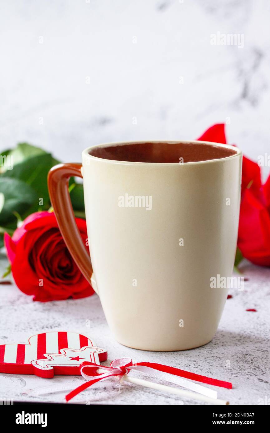 Valentine's Day Concept. Coffee mug with red roses on Ultimate Gray ...