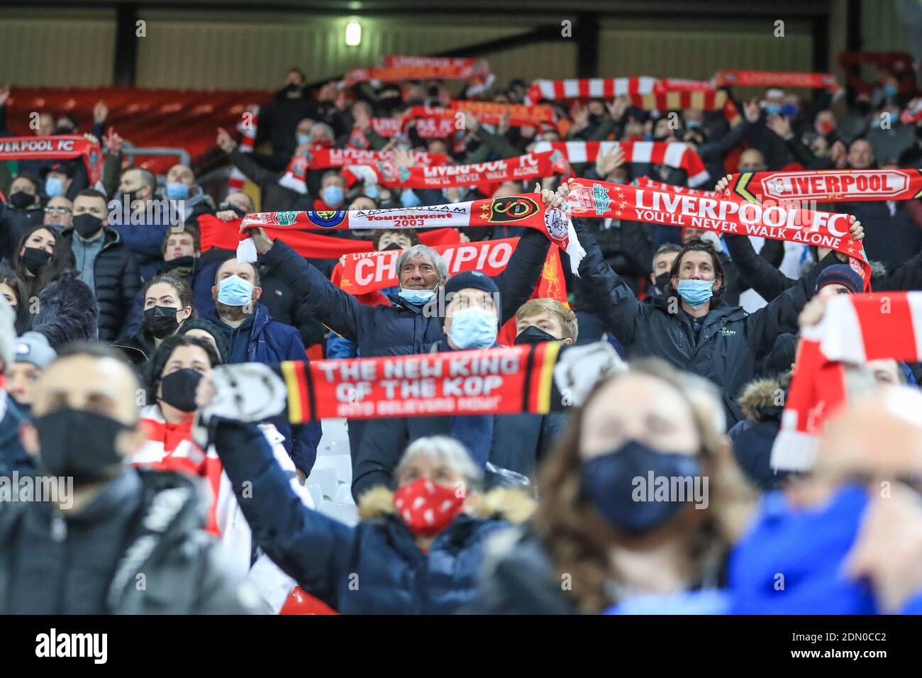Liverpool fans holds their scarfs up high as they sing ‘You’ll Never Walk Alone’ Stock Photo