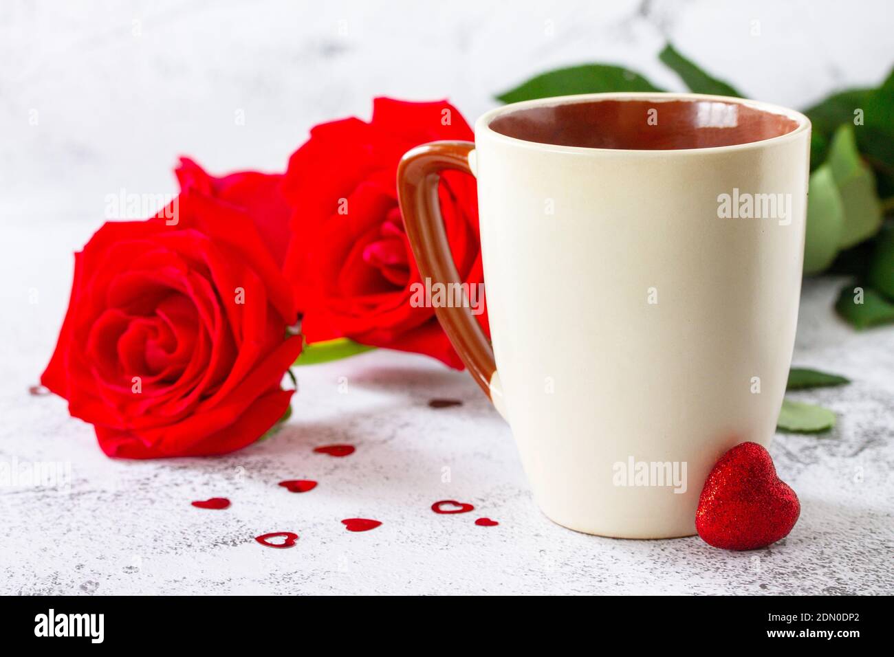 Valentine's Day Concept mockup. Coffee mug with red roses on Ultimate Gray  background. Space for text or design Stock Photo - Alamy