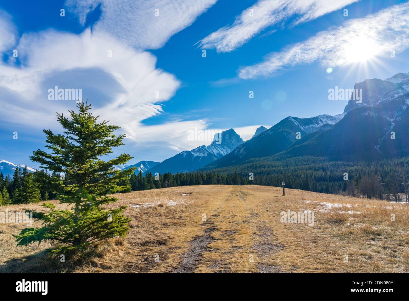 Quarry Lake Park, serene mountainside beach and dog park in late autumn season sunny day morning. Snow capped mountains with blue sky and white clouds Stock Photo