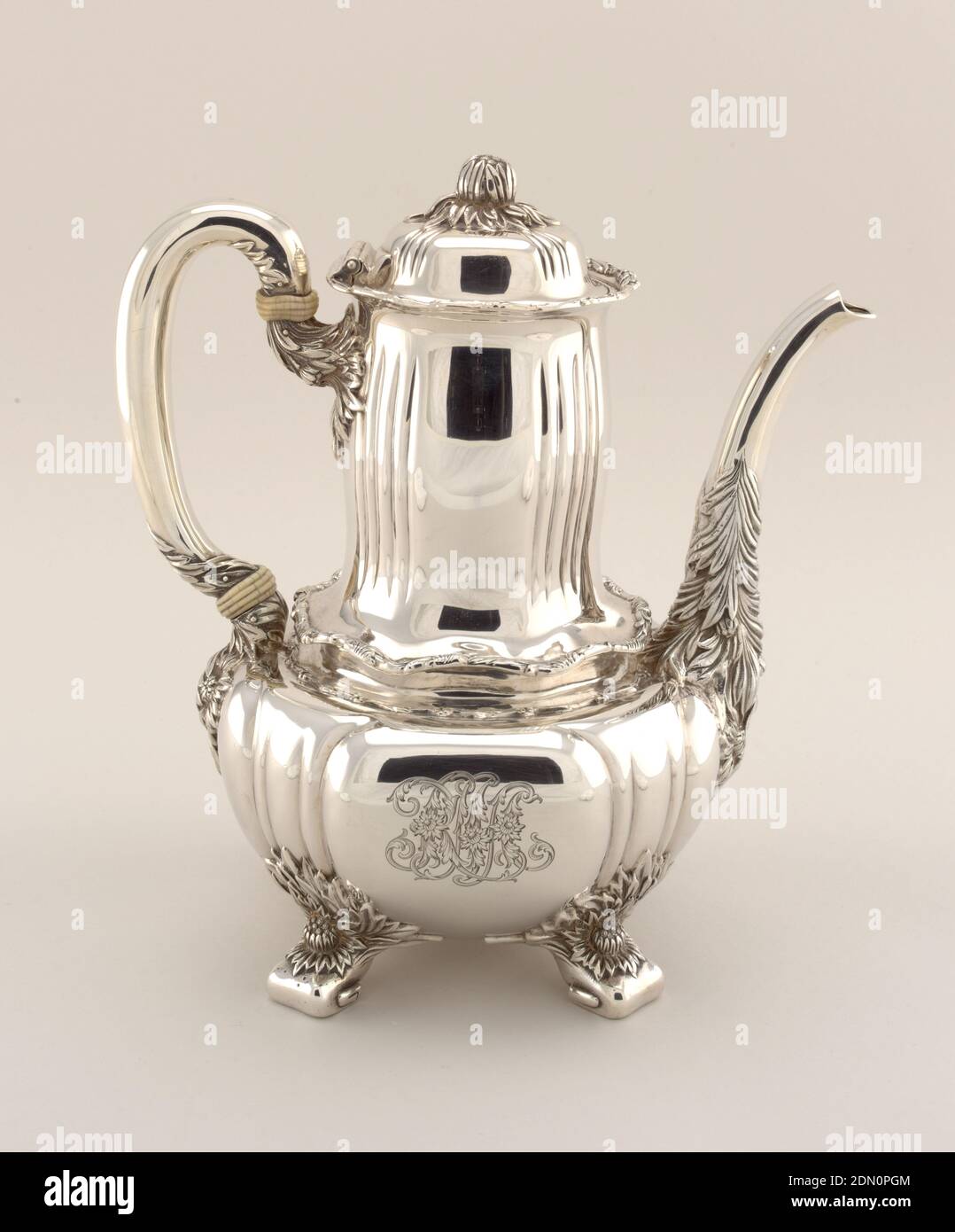 Chrysanthemum, Tiffany & Company, American, established 1853, Silver, ivory, Reeded globular body, engraved with foliate monogram 'RMA', rising to tall slightly bulging cylindrical neck with wavy rim; loop handle with ivory insulators on one side, and long curved spout heavily decorated with chrysanthemums and foliage opposite; base with four foliate feet. Slightly domed and reeded lid with flower bud knop., New York, New York, USA, 1891–1902, metalwork, Decorative Arts, coffeepot, coffeepot Stock Photo
