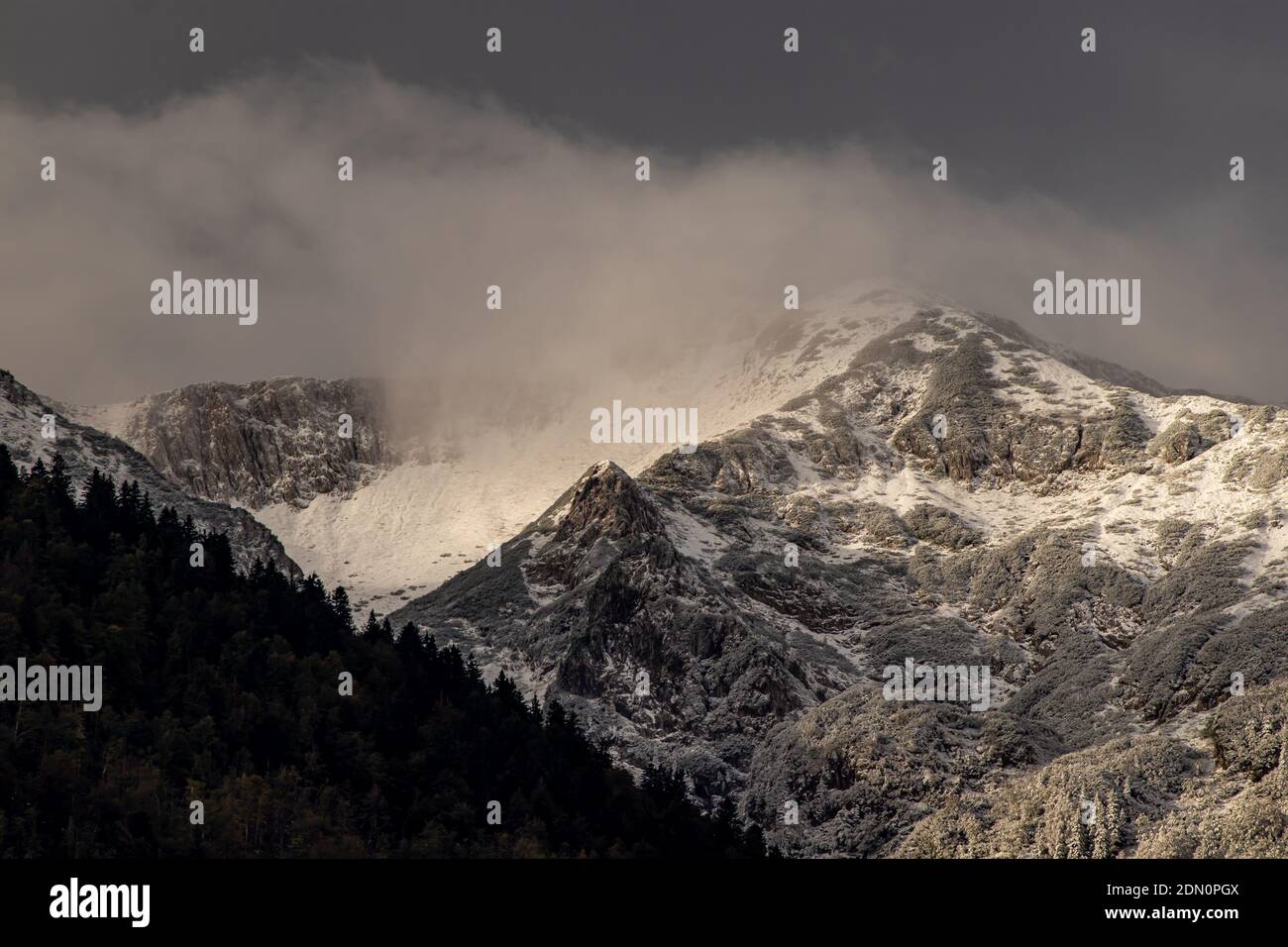 Cloud On Ridges Mountain ridge covered in clouds, winter Stock Photo - Alamy