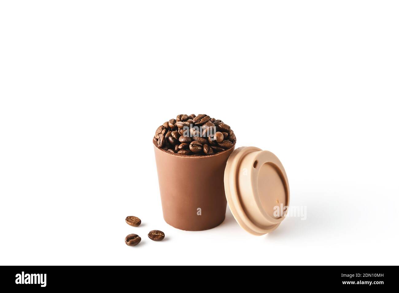 Beautiful takeaway cup made of chocolate filled with coffee beans on