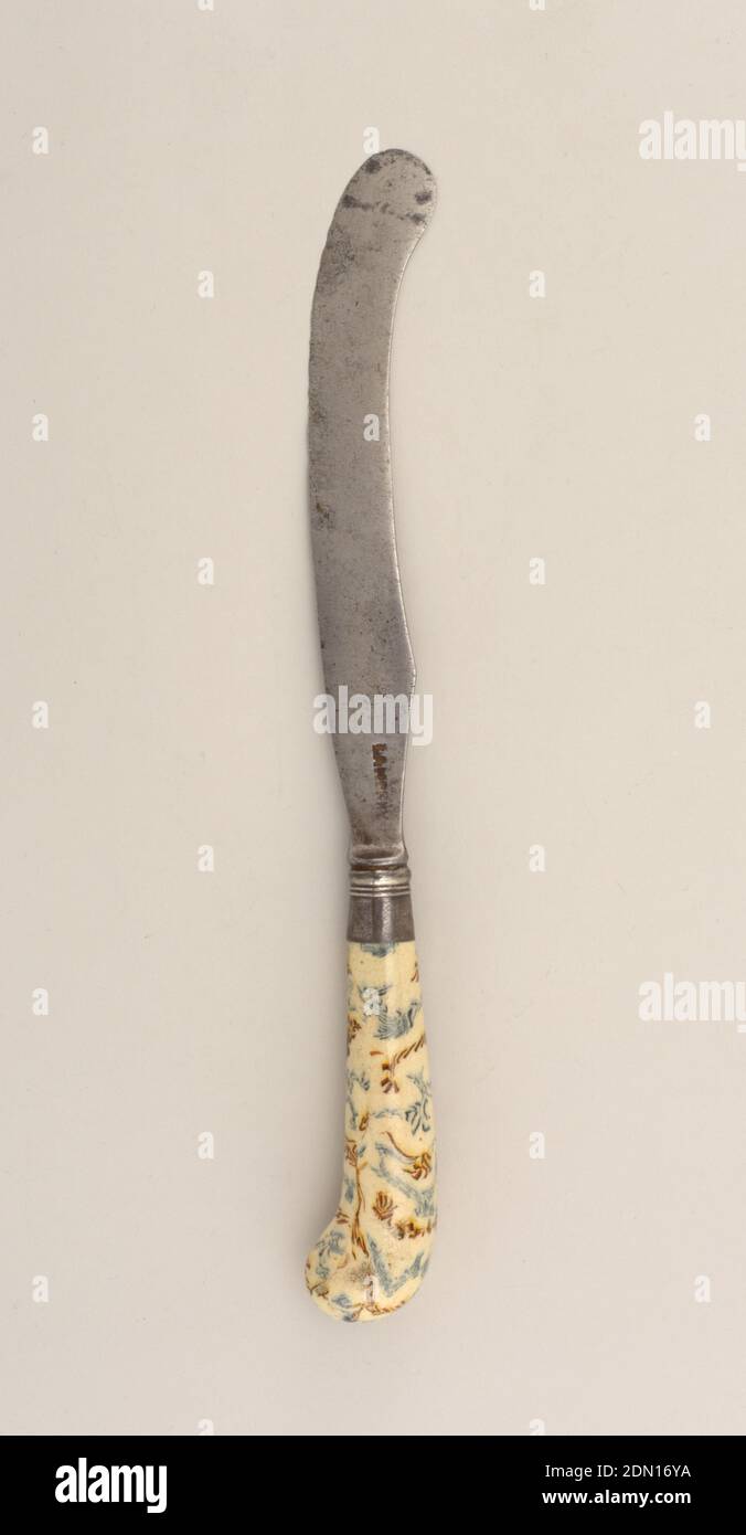 Knife with Saber-Shaped Blade, steel, earthenware, silver, Saber-shaped blade, waisted bolster. Banded silver ferrule. Pistol-shaped earthenware handle, cream ground with marble pattern in yellow, brown and blue, clear glaze., England, ca. 1745, cutlery, Decorative Arts, knife, knife Stock Photo