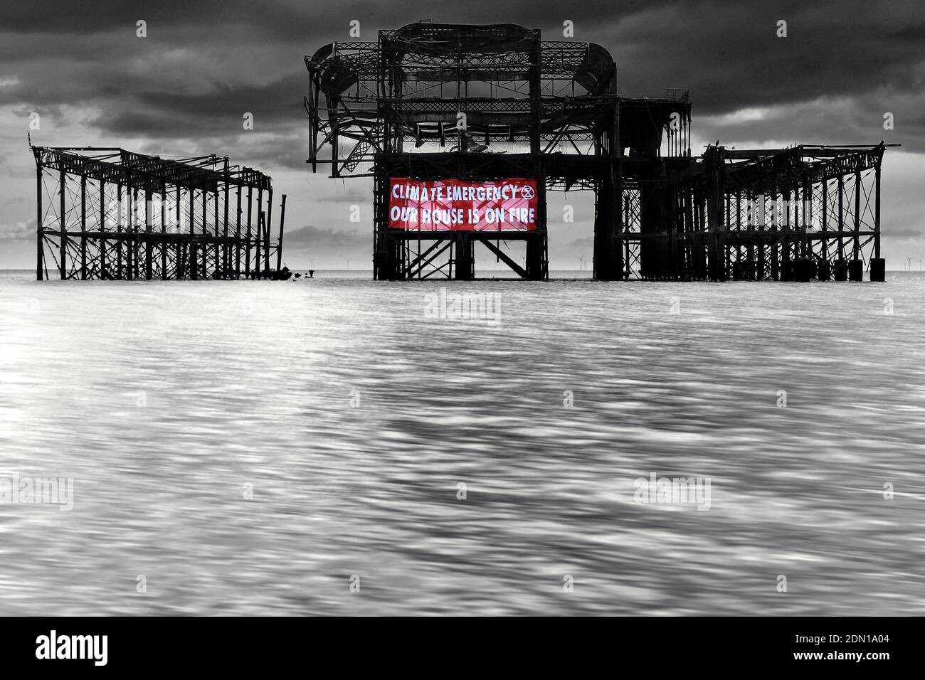 Climate emergency protest banner on west pier. Stock Photo